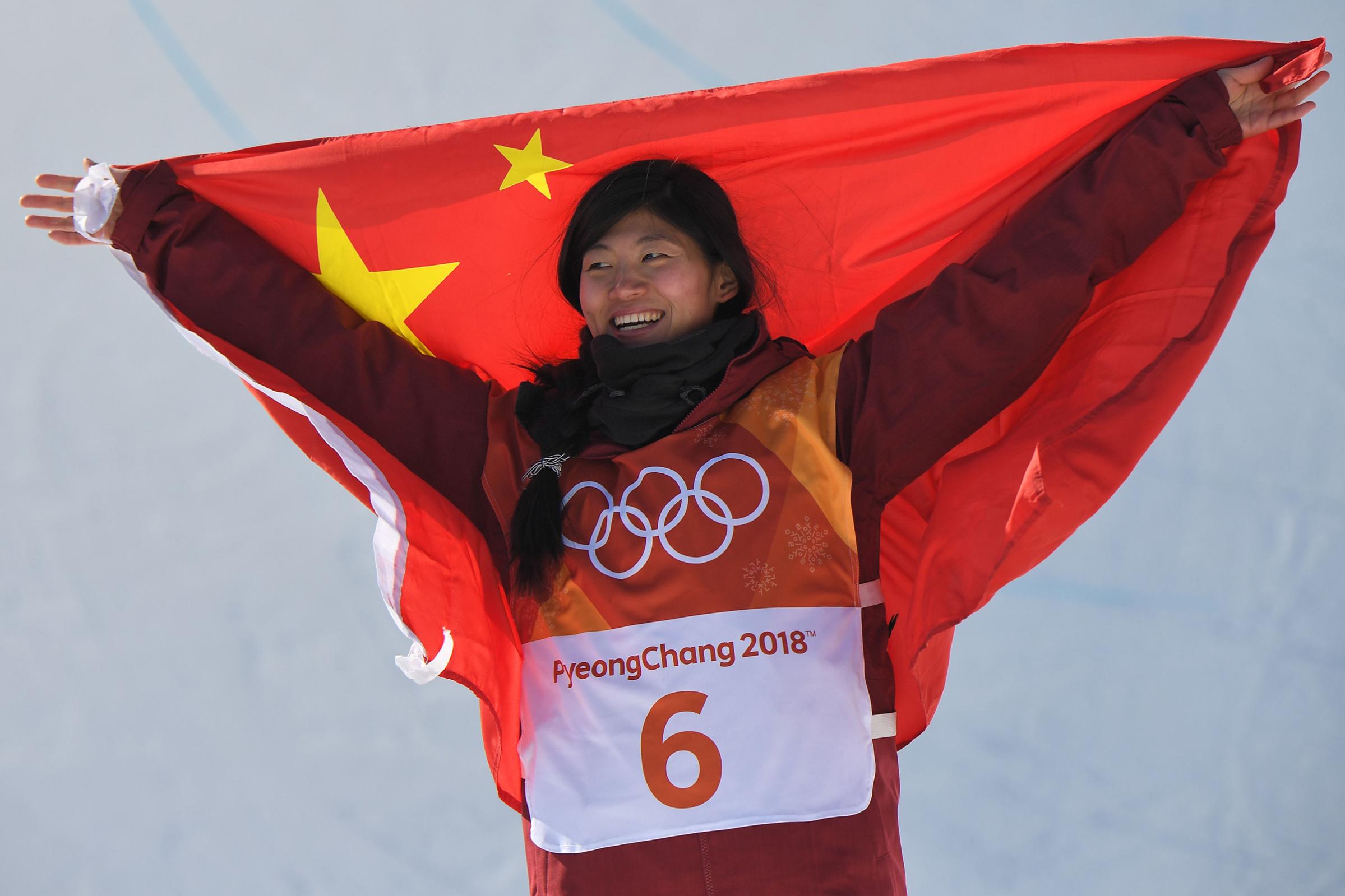 Silver medallist China's Liu Jiayu celebrates during the victory ceremony after the women's snowboard halfpipe final on Feb. 13, 2018.