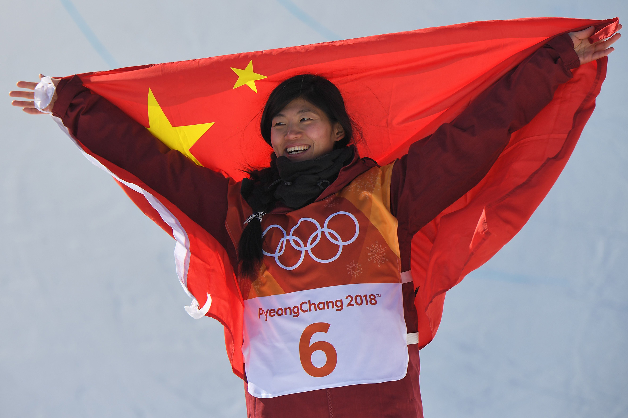 Silver medallist China's Liu Jiayu celebrates during the victory ceremony after the women's snowboard halfpipe final on Feb. 13, 2018. (Loic Venance—AFP/Getty Images:)