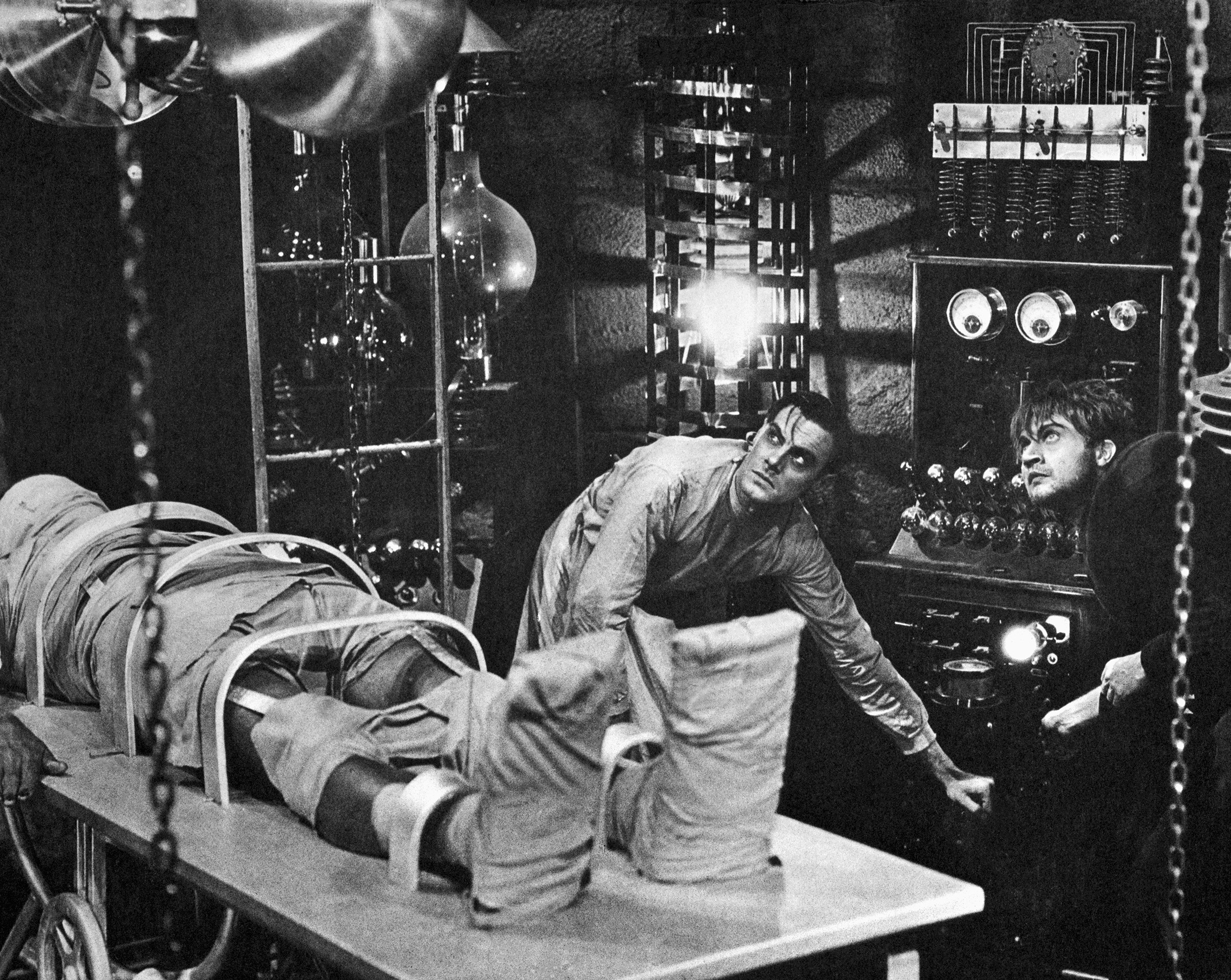 Colin Clive, as Dr. Frankenstein, and Dwight Frye, as his assistant Fritz, prepare to bring their monster to life in a scene from the 1931 movie version of Mary Shelley's Frankenstein. (Bettmann Archive/Getty Images)