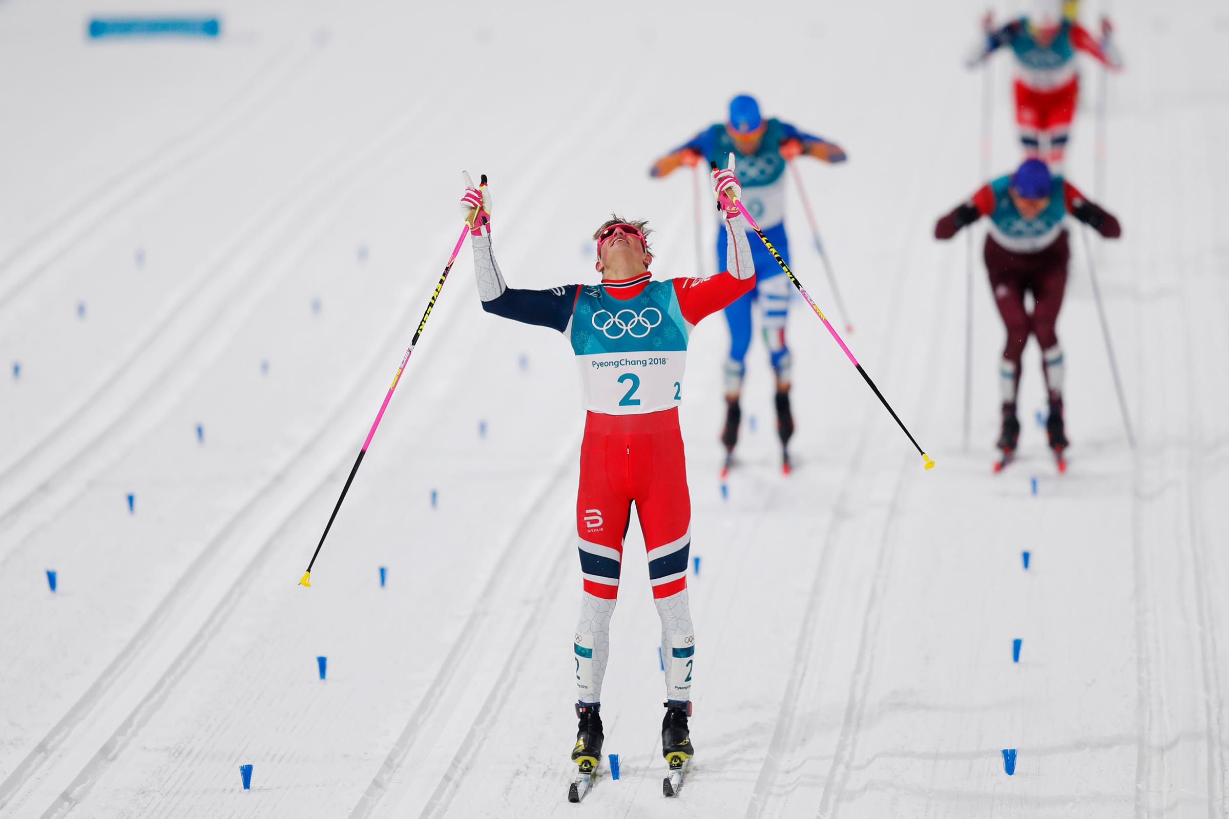 Johannes Hoesflot Klaebo of Norway celebrates after the victory during the Mens Individual Sprint Classic Finals on Feb. 13, 2018.