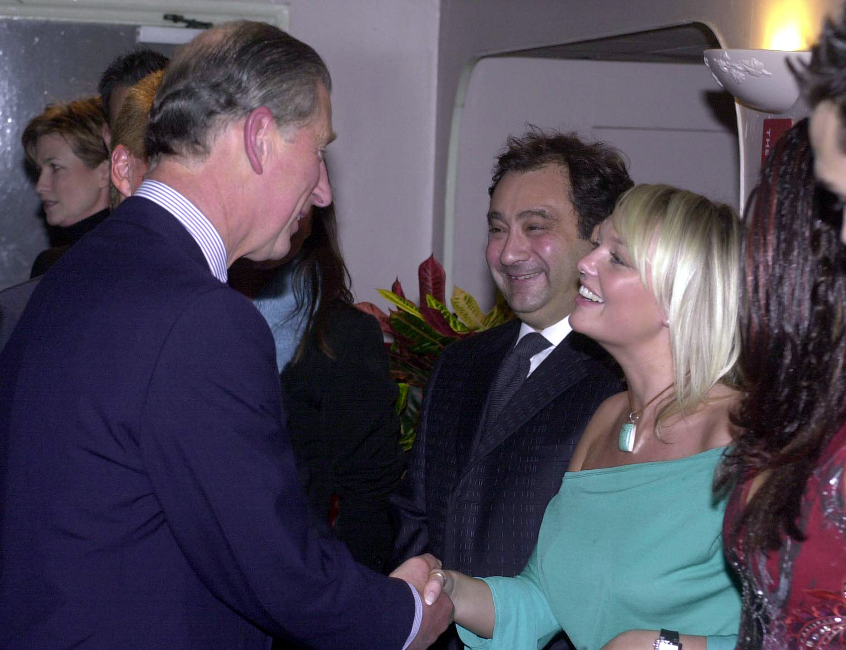 The Prince of Wales, Prince Charles, shakes hands with former 'Spice Girl' Emma Bunton backstage before the Will Young and Gareth Gates pop concert in aid of the Princes's trust at Wembley Arena. (John Stillwell - PA Images—PA Images via Getty Images)