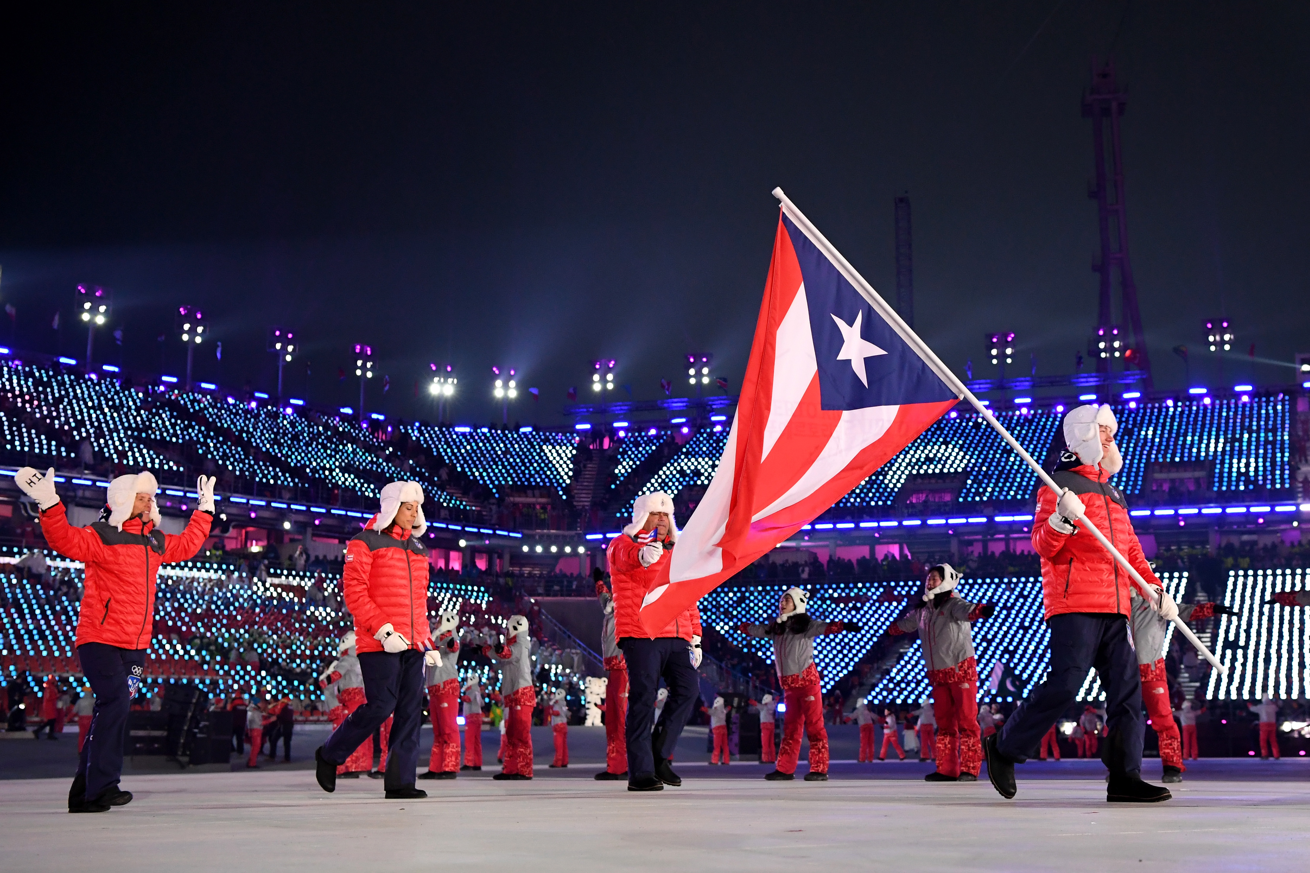 Flag bearer Charles Flaherty of Puerto Rico and teammates arrive at the stadium during the Opening Ceremony of the PyeongChang 2018 Winter Olympic Games at PyeongChang Olympic Stadium on February 9, 2018 in Pyeongchang-gun, South Korea. (Matthias Hangst&mdash;Getty Images)