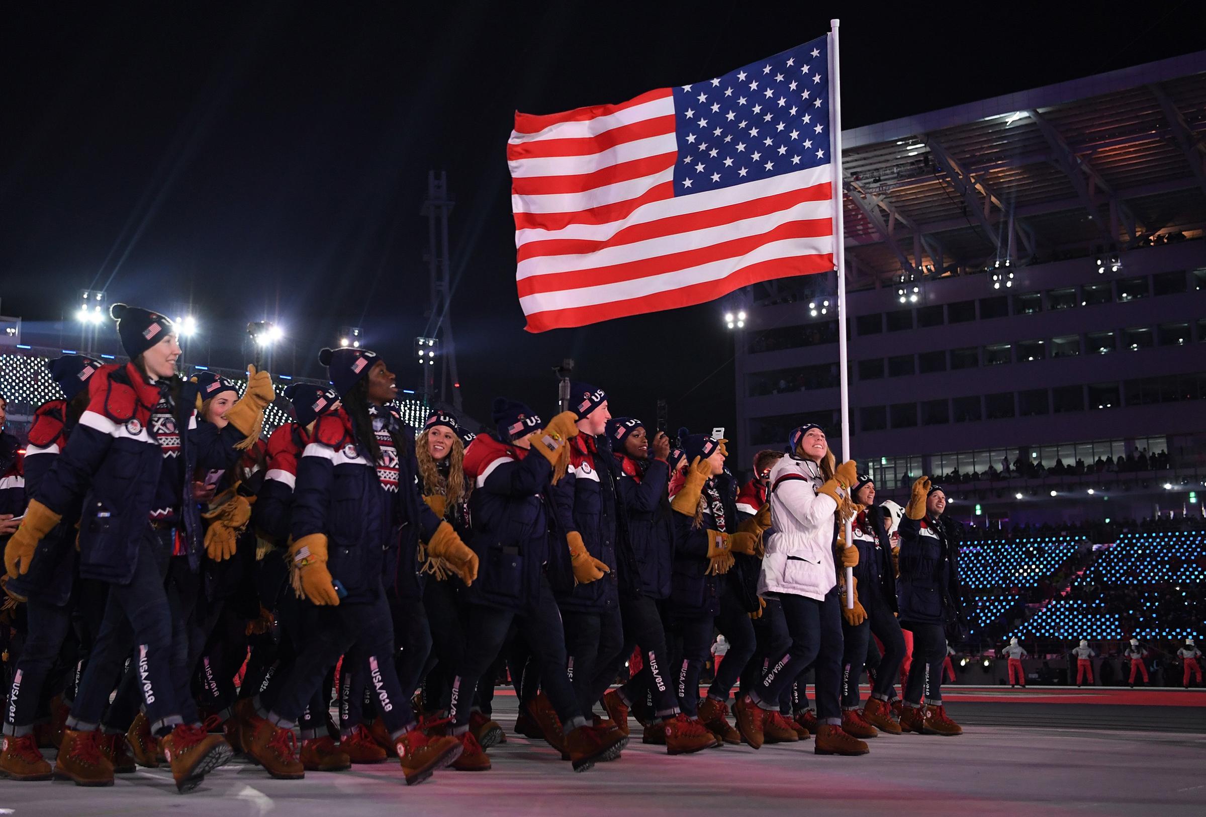 Flag bearer Erin Hamlin of the United States leads the team in the Parade of Athletes during the Opening Ceremony of the PyeongChang 2018 Winter Olympic Games.