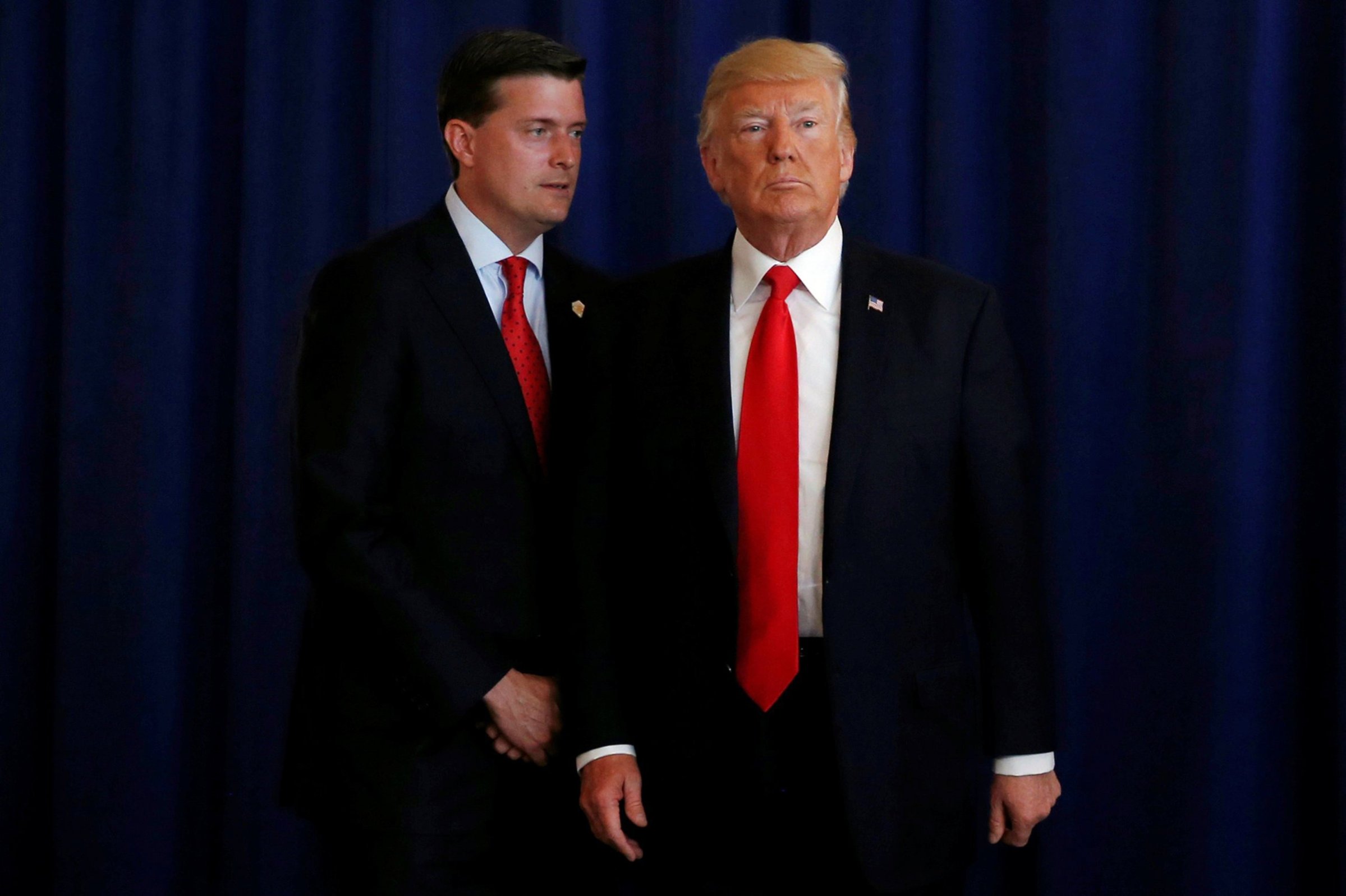 White House Staff Secretary Rob Porter speaks to President Donald Trump at his golf estate in Bedminster, New Jersey, Aug. 12, 2017.
