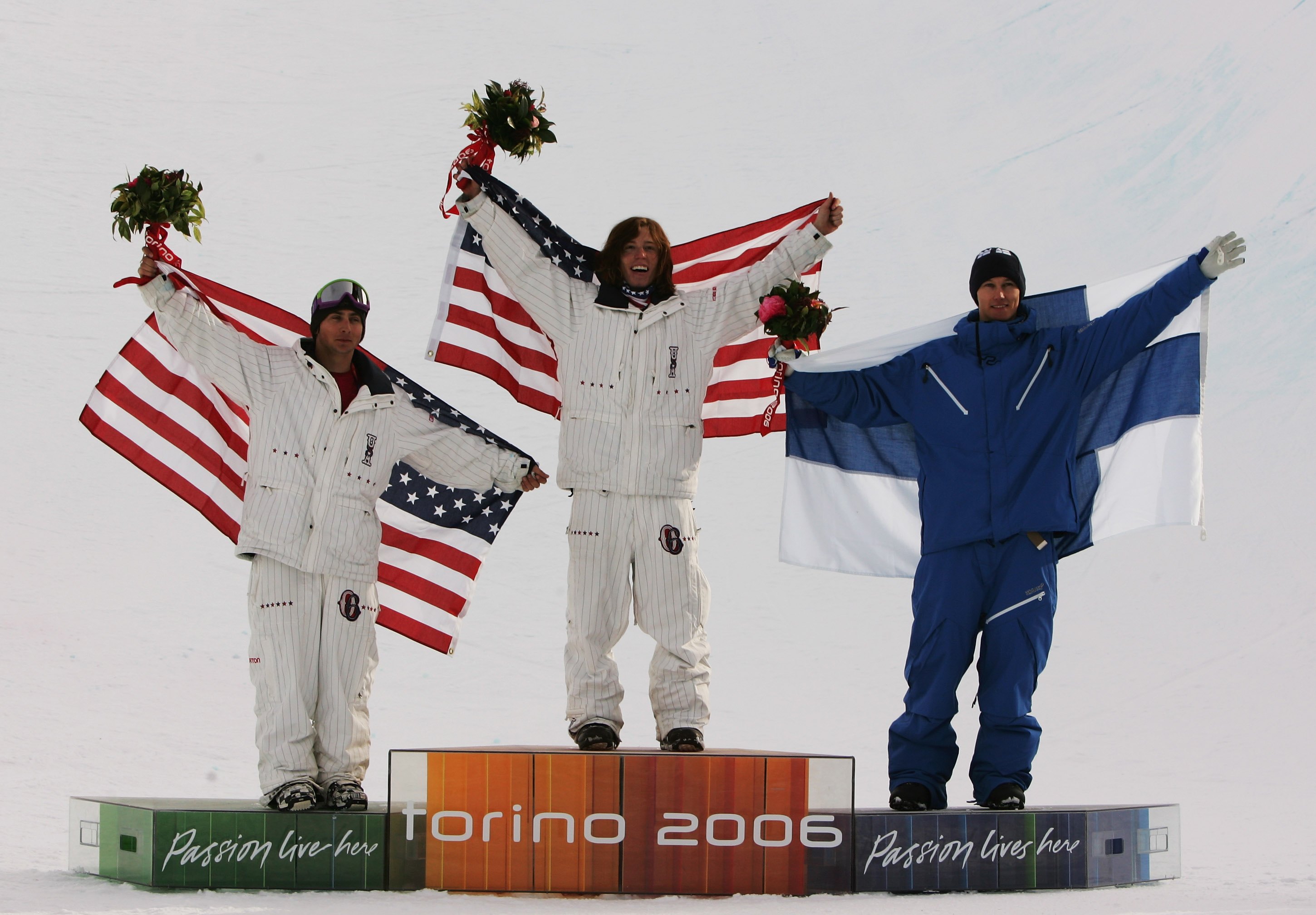 Shaun White (C) celebrates after winning the Gold Medal with teammate Daniel Kass (L) and Markku Koski of Finland in the Mens Snowboard Half Pipe Final at the 2006 Turin Winter Olympic Games in Bardonecchia, Italy. Adam Pretty—Getty Images (Adam Pretty—Getty Images)