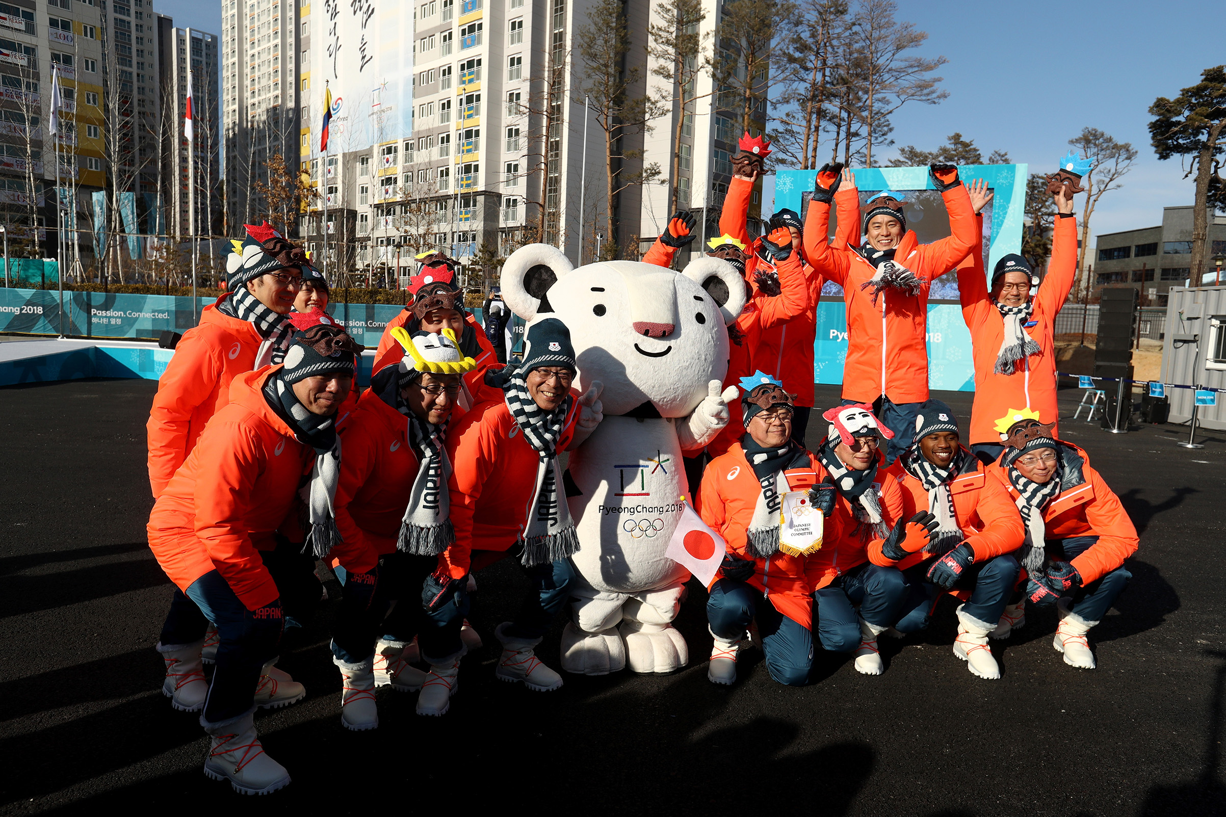 Members of the Japan team pose with mascot Soohorang ahead of the PyeongChang 2018 Winter Olympic Games on Feb. 7, 2018. (Robert Cianflone—Getty Images)