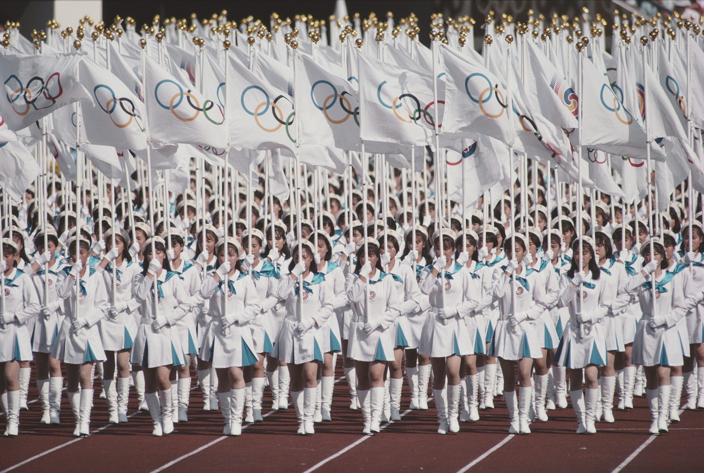 The Olympic Flag is presented in the Olympic Stadium during the Opening Ceremony of the XXIV Summer Olympic Games on Sep. 17, 1988, at the Seoul Olympic Stadium in Seoul, South Korea. (Gray Mortimore—Getty Images)
