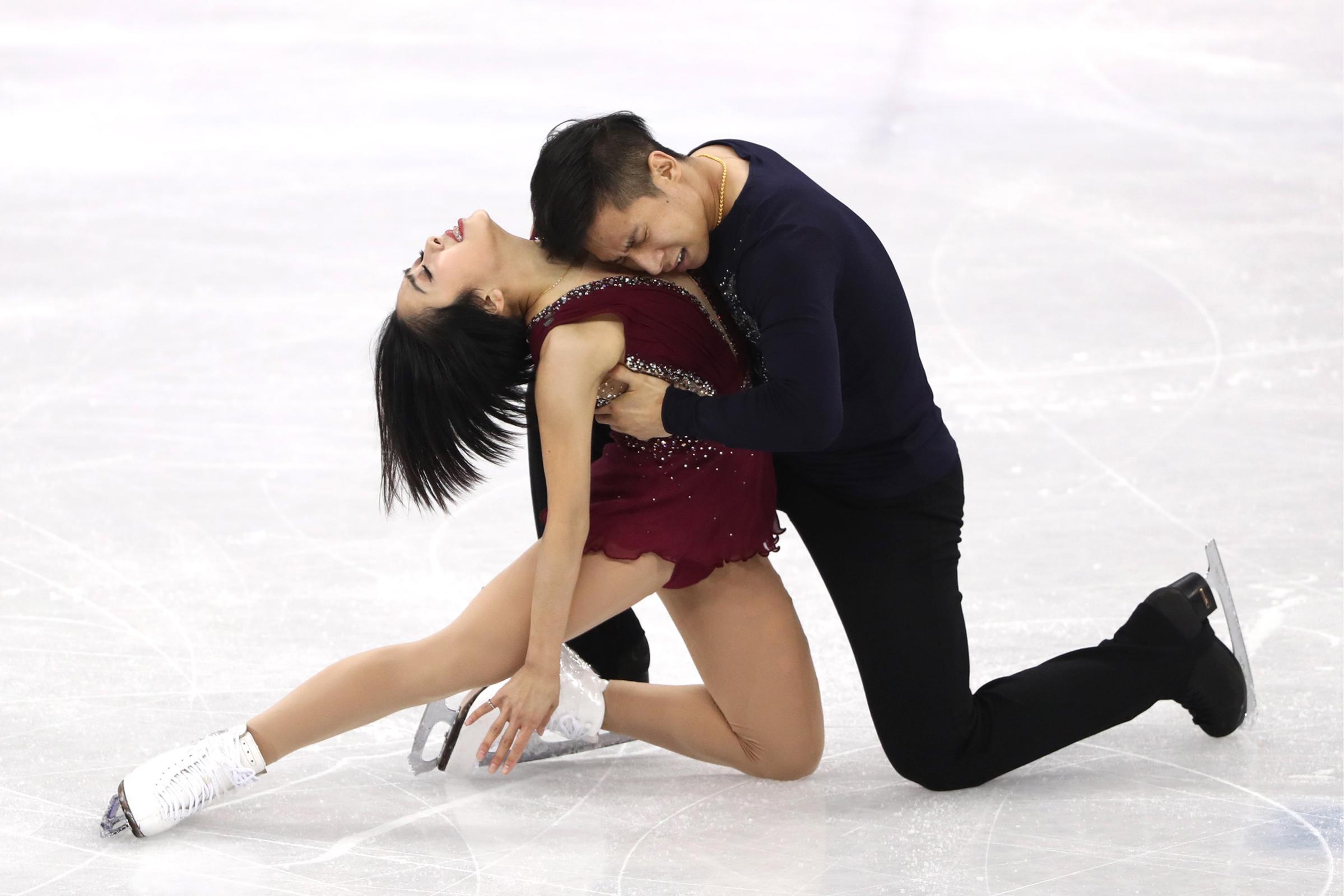 China's pair skaters Sui Wenjing and Han Cong perform their short program during a figure skating event at the 2018 Winter Olympic Games at Gangneung Ice Arena.