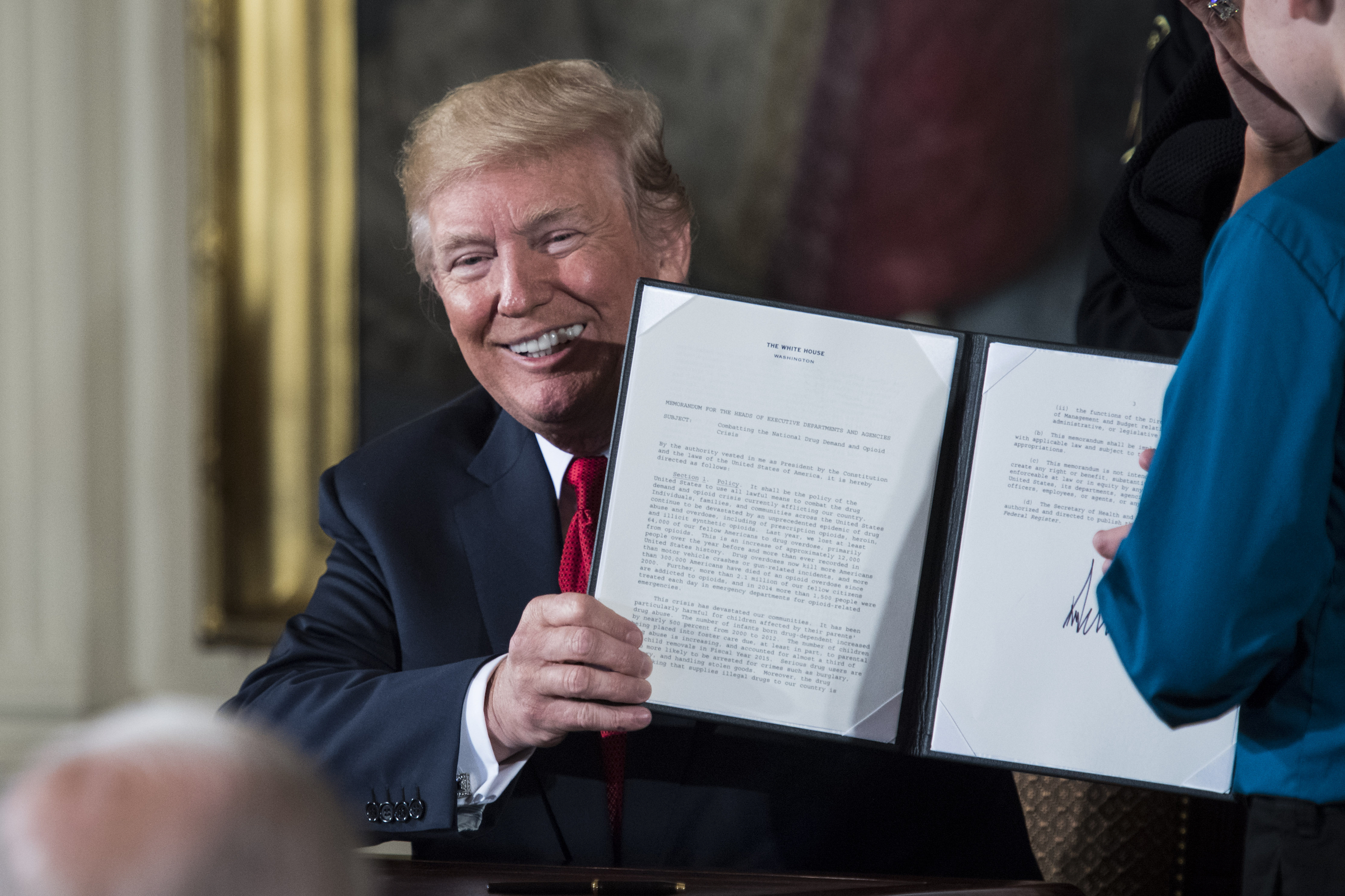 President Donald Trump signs a presidential memorandum to declare the opioid crisis a national public health emergency in the East Room of the White House in Washington, D.C., on Oct. 26, 2017. (Jabin Botsford&mdash;The Washington Post/Getty Images)