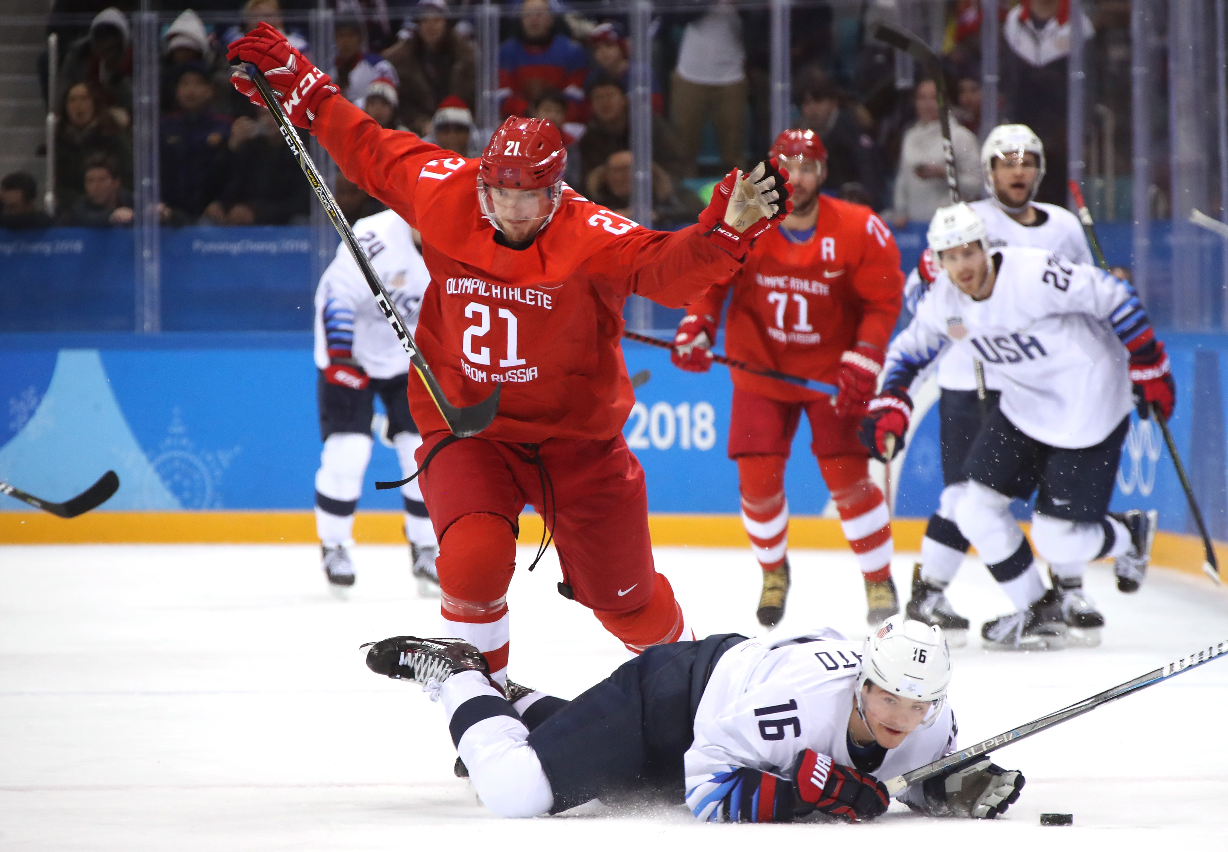Sergei Kalinin #21 of Olympic Athlete from Russia falls to the ice after tripping Ryan Donato #16 of the United States during the Men's Ice Hockey Preliminary Round Group B game on day eight of the PyeongChang 2018 Winter Olympic Game (Bruce Bennett – Getty Images)
