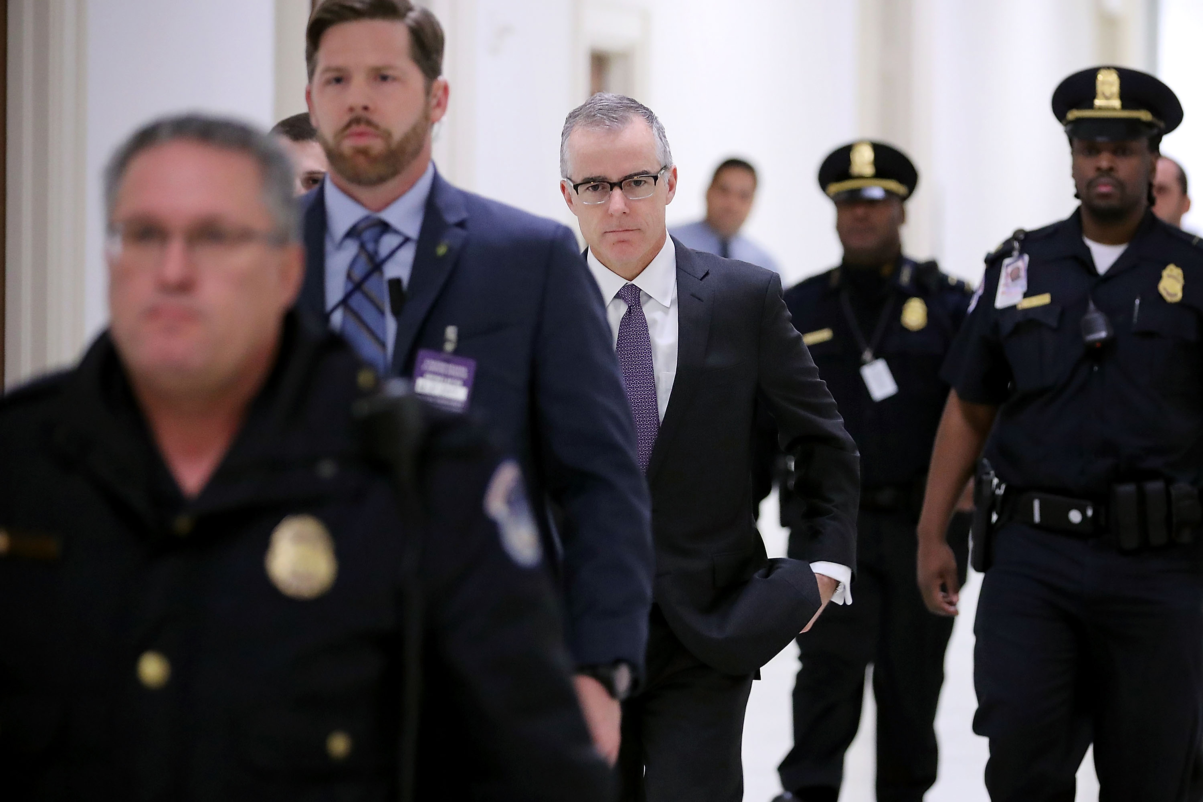 FBI deputy director Andrew McCabe, center, is escorted to a meeting with members of the Oversight and Government Reform and Judiciary committees in Washington on Dec. 21, 2017 (Chip Somodevilla—Getty Images)