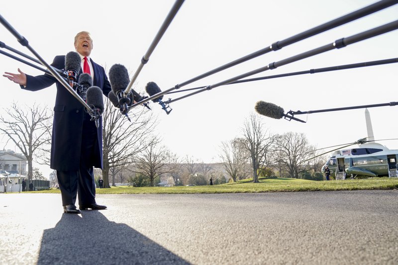 President Donald Trump speaks to reporters before boarding Marine One on the South Lawn of the White House in Washington on March 13, 2018. (Andrew Harnik—AP)