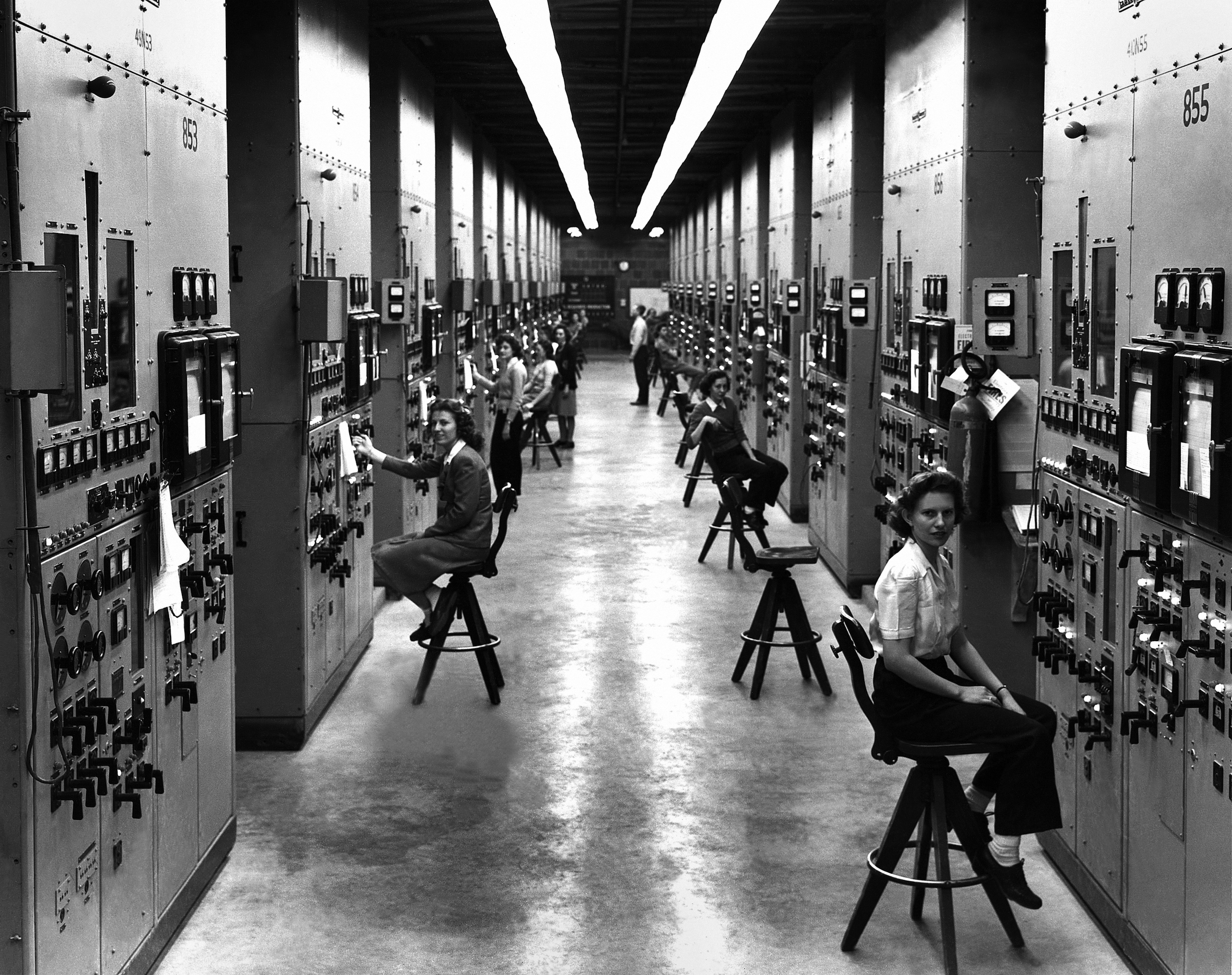 Calutron operators at their panels, in the Y-12 plant at Oak Ridge during World War II. 1944. The calutrons were used to refine uranium ore into fissile material. During the Manhattan Project effort to construct an atomic explosive, workers toiled in secrecy, with no idea to what end their labors were directed. Gladys Owens, the woman seated in the foreground, did not realize what she had been doing until seeing this photo in a public tour of the facility fifty years later. Tennessee, USA.  (Photo by Galerie Bilderwelt/Getty Images) (Galerie Bilderwelt/Getty Images)