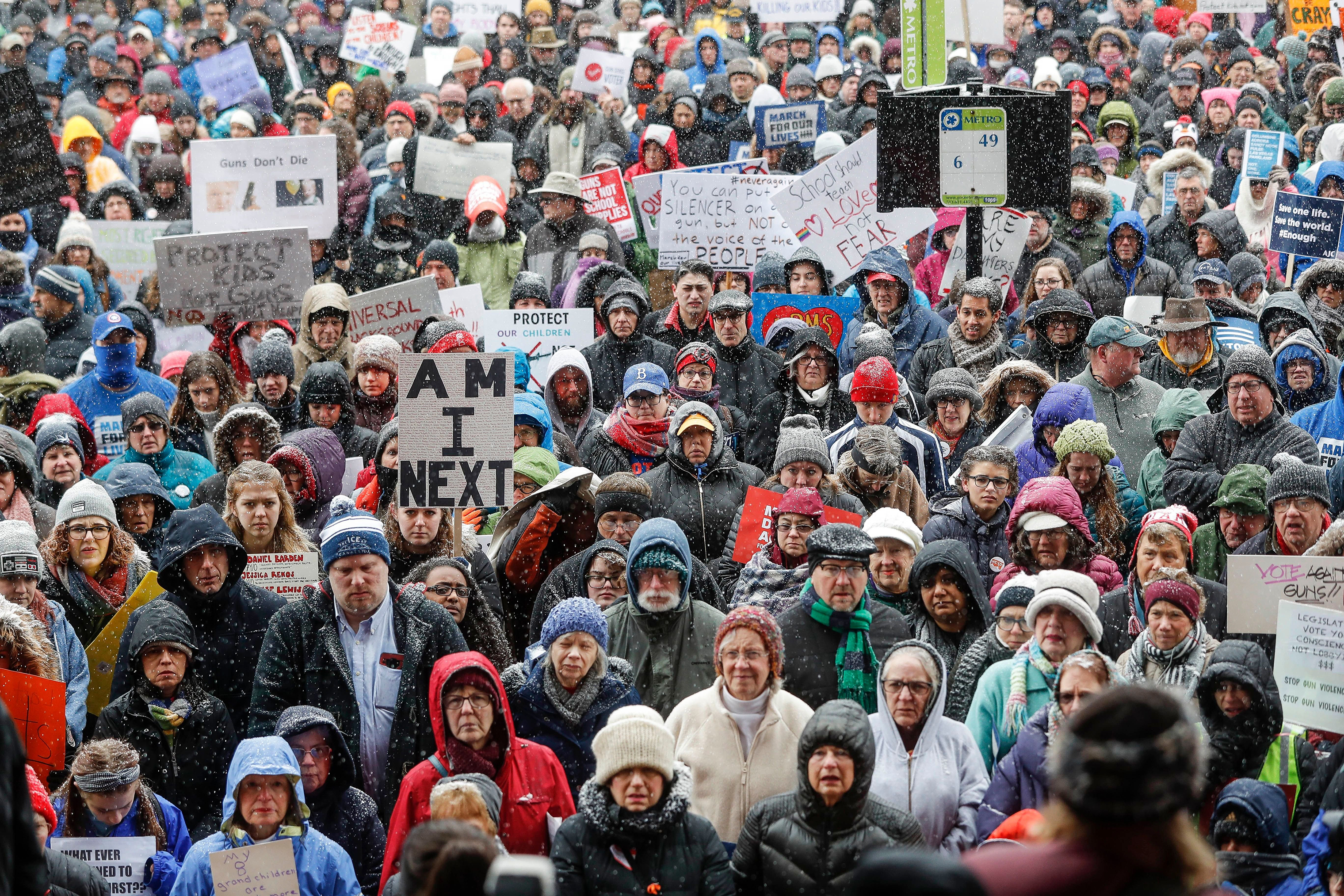 Demonstrators gather outside city hall during the March for Our Lives protest for gun legislation and school safety. (John Minchillo—AP/Shutterstock)