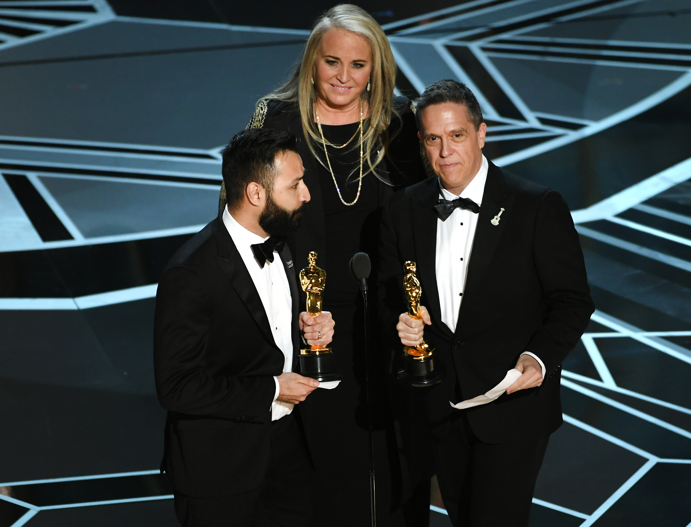 Filmmakers Adrian Molina, Darla K. Anderson and Lee Unkrich accept Best Animated Feature Film for 'Coco' onstage during the 90th Annual Academy Awards at the Dolby Theatre at Hollywood &amp; Highland Center on March 4, 2018 in Hollywood. (Kevin Winter—Getty Images)