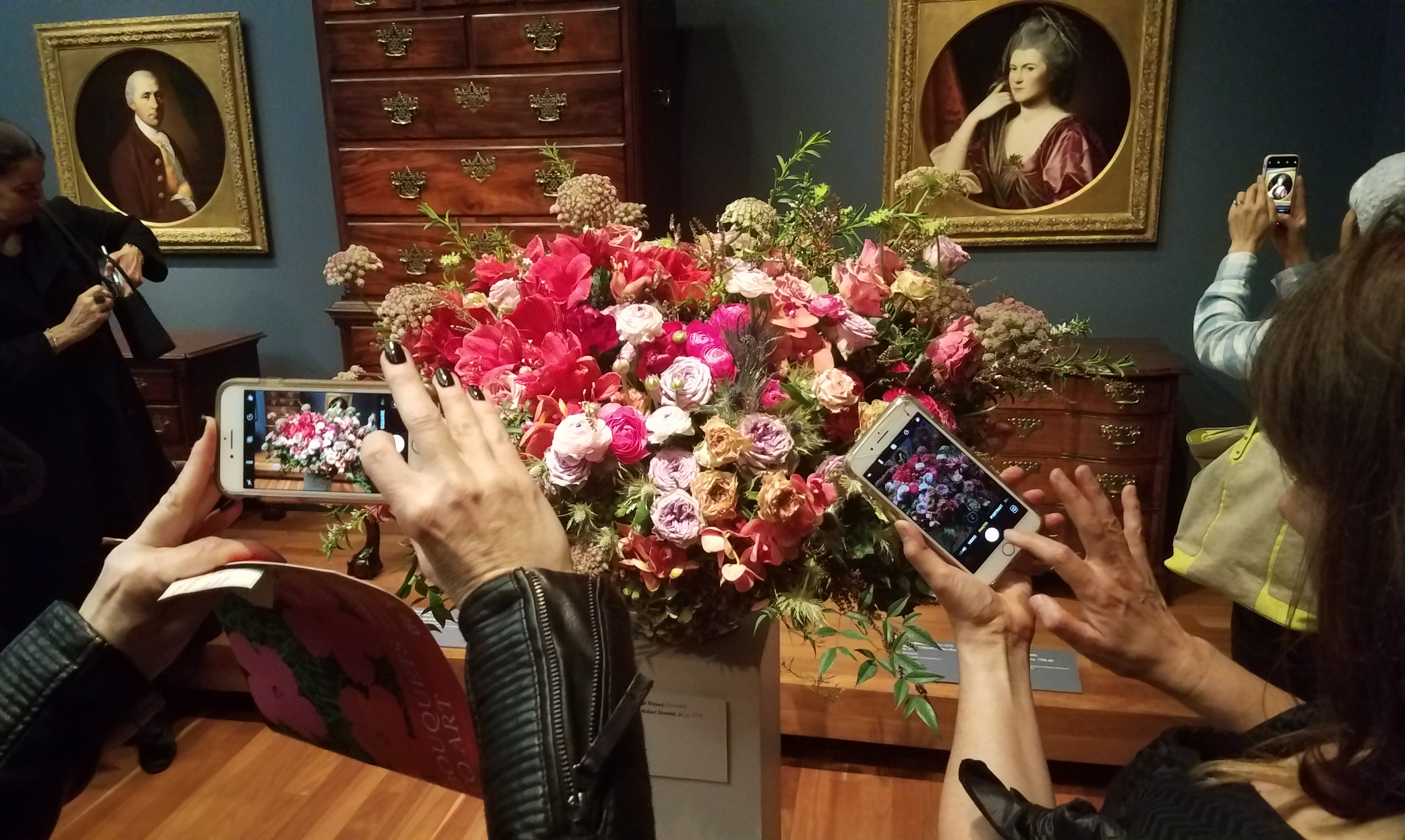 Museum goers take photos at the Bouquets to Art exhibit at the de Young Museum in San Francisco on Wednesday, March 14, 2018. (Katy Steinmetz for TIME)