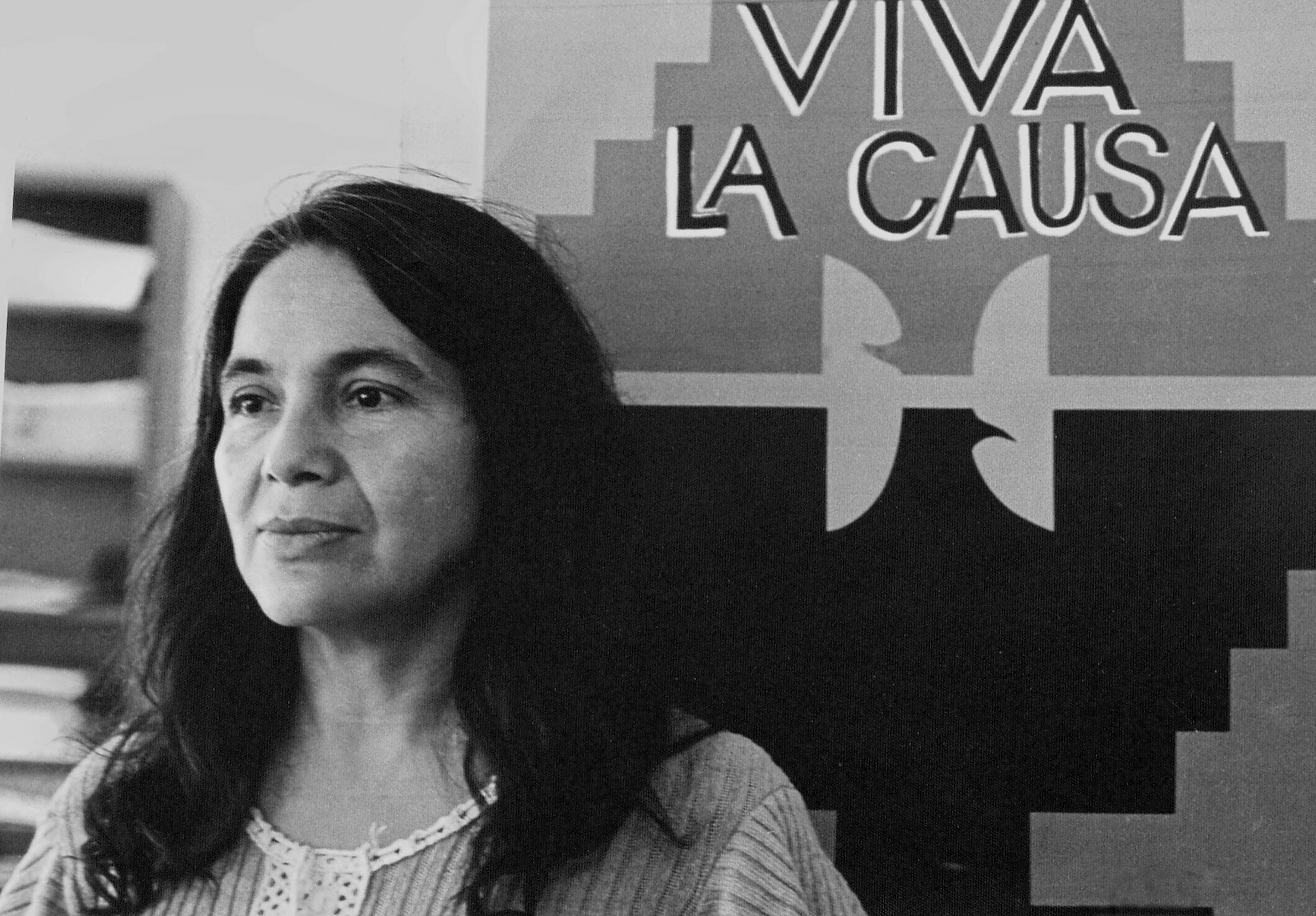 Portrait of labor activist Dolores Huerta, co-founder of the United Farm Workers group, with a union flag that reads 'Viva La Causa,' ca.1970s. (Cathy Murphy—Getty Images)