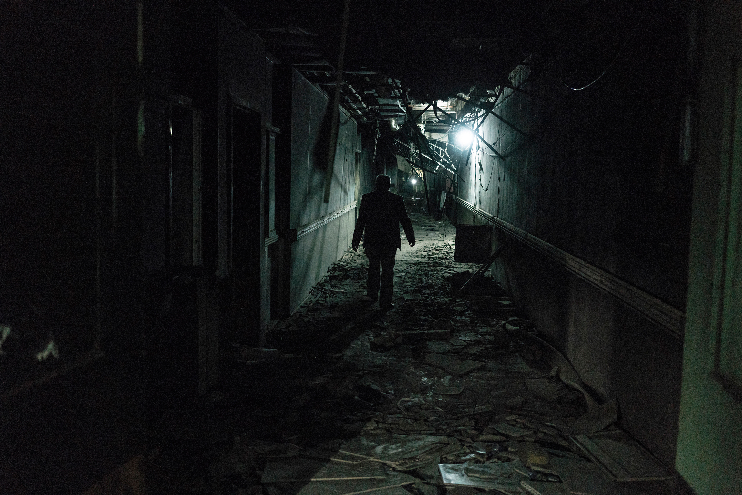 A man walks inside a corridor of the Fallujah Teaching Hospital on Feb. 1. (Emanuele Satolli for TIME)