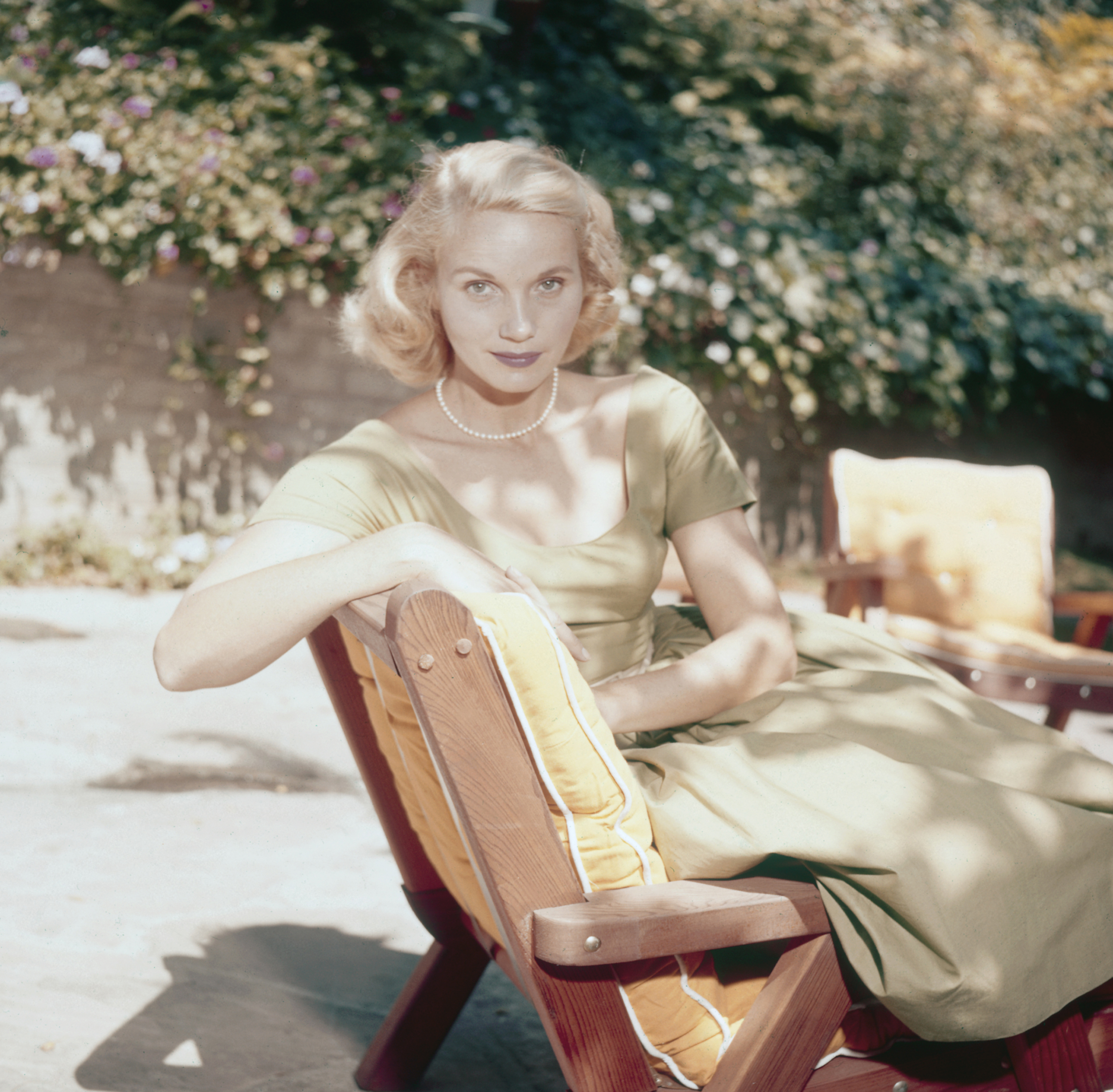 Actress Eva Marie Saint pictured seated on a sun lounger in a garden circa 1950. (Archive Photos/Getty Images)