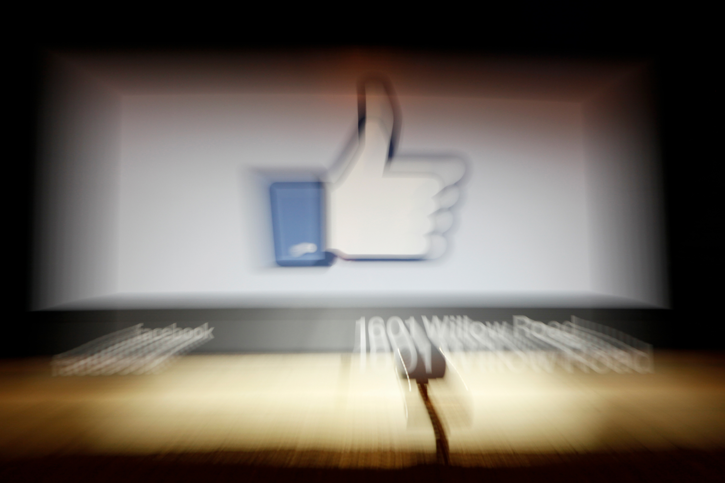 A Facebook Like Button logo is seen at the entrance of the Facebook headquarters in Menlo Park, Calif., on May 10, 2012. (Kimihiro Hoshino—AFP/GettyImages)