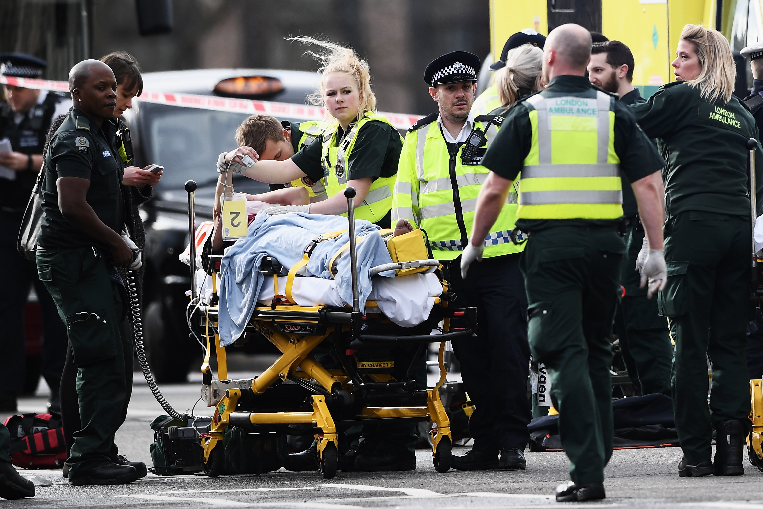 A member of the public is treated by emergency services near Westminster Bridge and the Houses of Parliament on March 22, 2017 in London, England. (Carl Court&mdash;Getty Images)