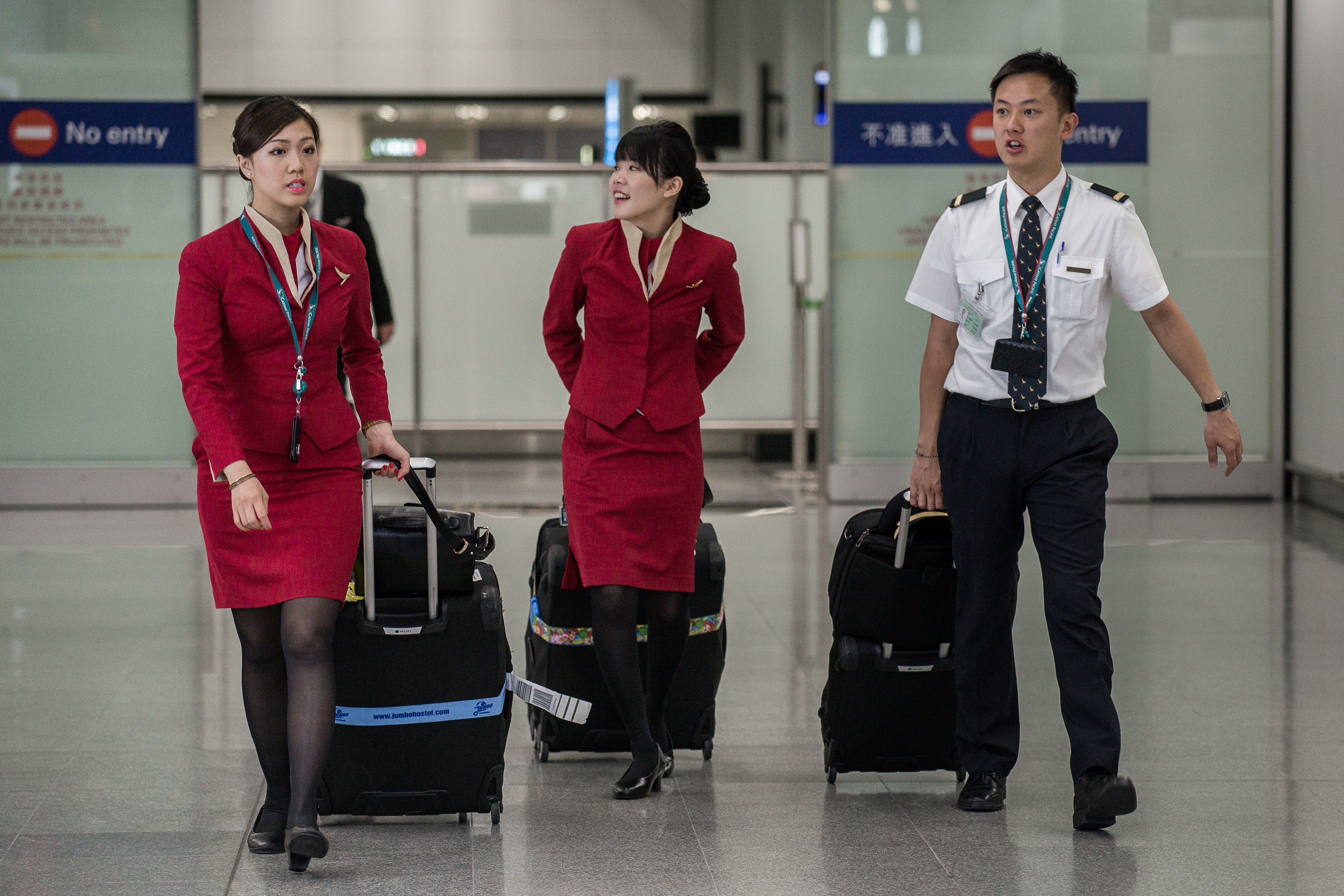 Flight attendants for Cathay Pacific arrive at the international airport in Hong Kong on May 5, 2014. (Philippe Lopez&mdash;AFP/Getty Images)