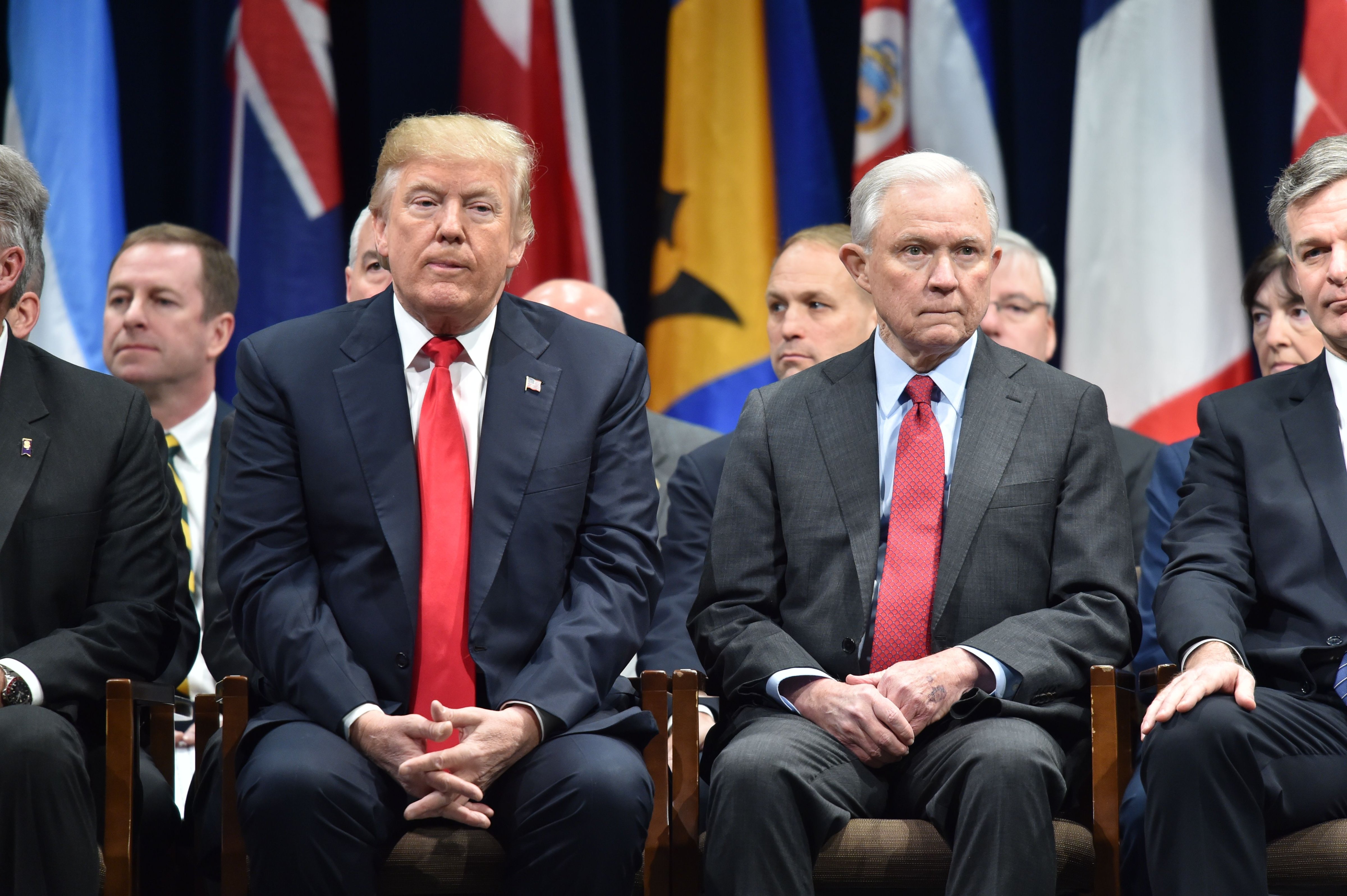 US President Donald Trump(L)sits with Attorney General Jeff Sessions on December 15, 2017 in Quantico, Virginia, before participating in the FBI National Academy graduation ceremony. (NICHOLAS KAMM—AFP/Getty Images)