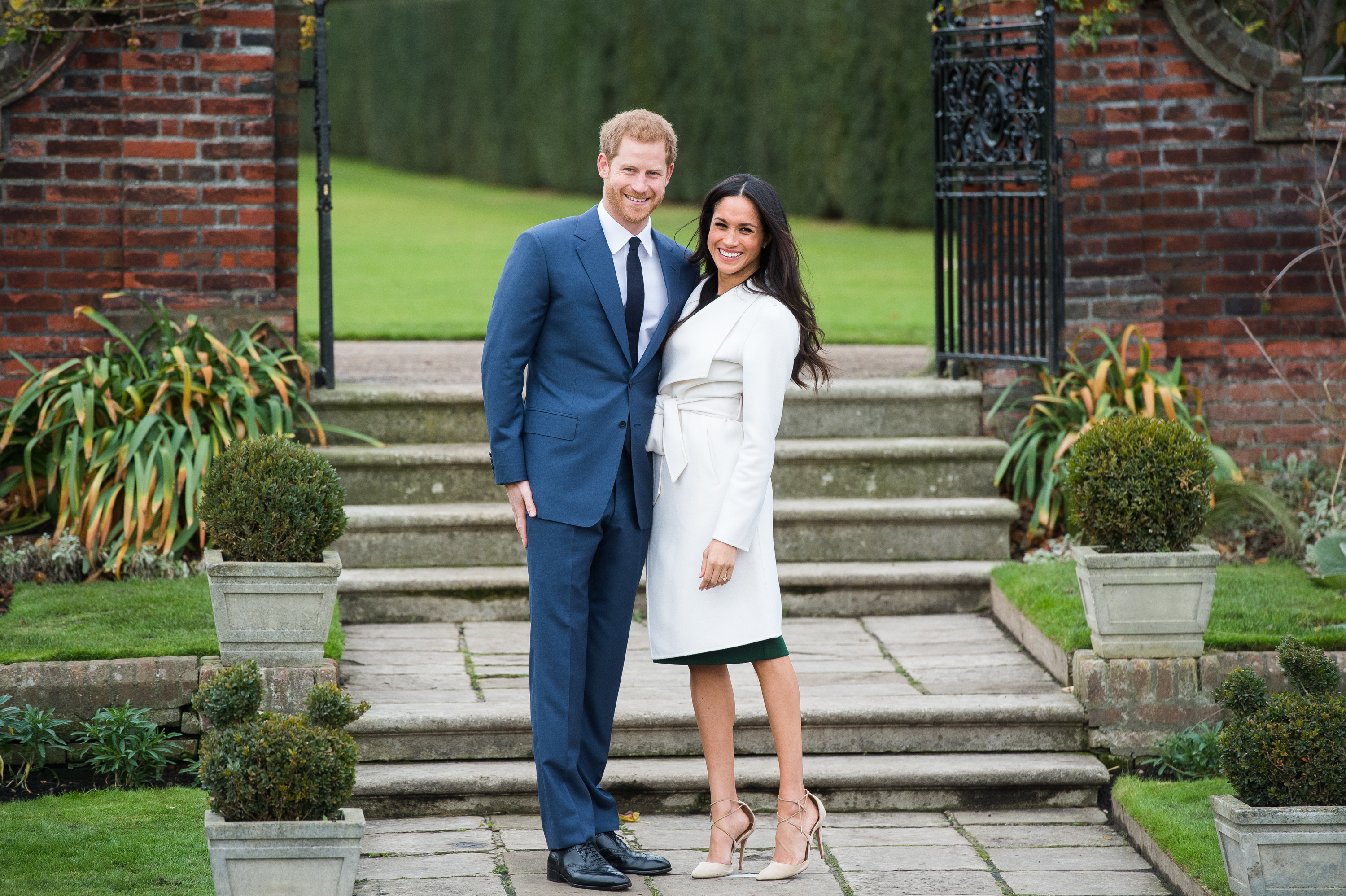Prince Harry and Meghan Markle during an official photocall at The Sunken Gardens at Kensington Palace to announce their engagement on November 27, 2017. Samir Hussein—Samir Hussein/WireImage (Samir Hussein—Samir Hussein/WireImage)
