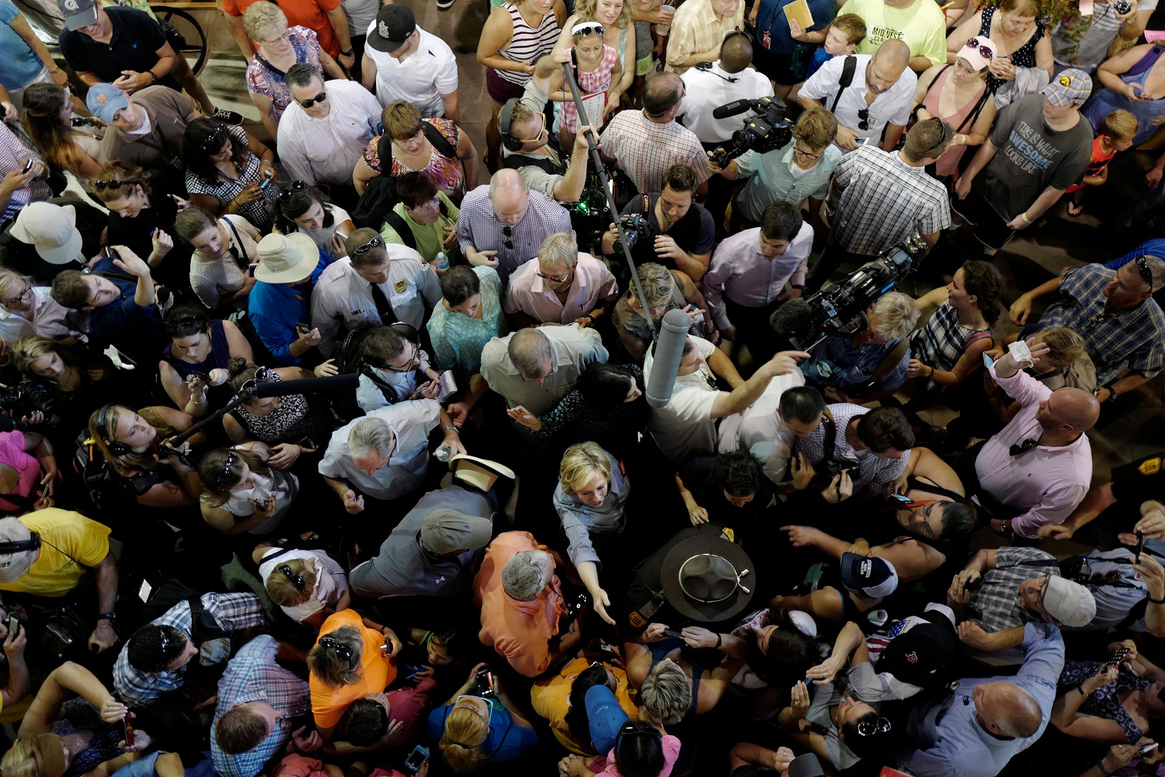 Hillary Clinton is a face in the crowd as she tours the Agriculture Building at the Iowa State Fair in Des Moines, Iowa, on Aug. 15, 2015.