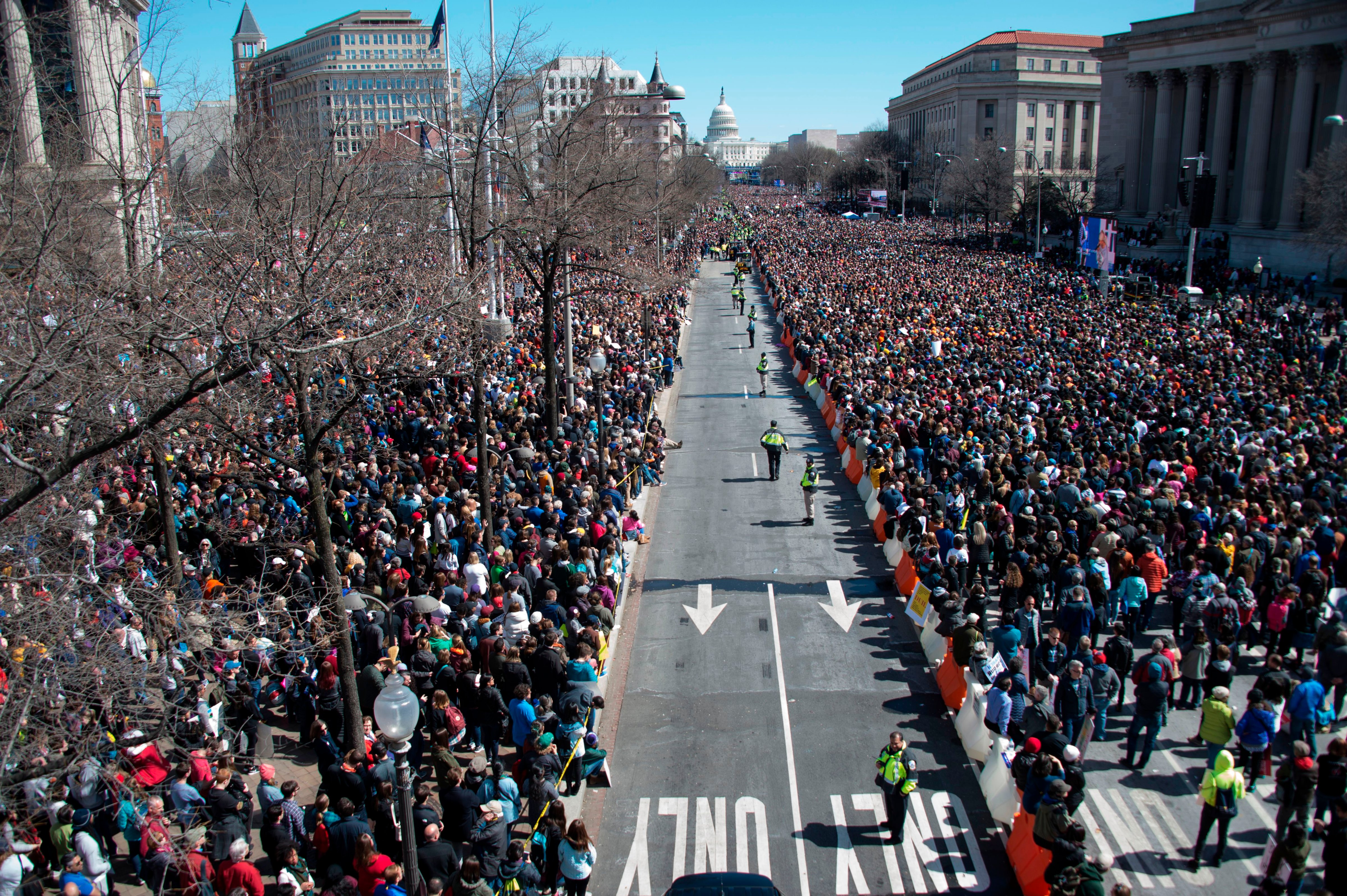 People take part in the March For Our Lives rally against gun violence in Washington, DC on March 24, 2018. Galvanized by a massacre at a Florida high school, hundreds of thousands of Americans are expected to take to the streets in cities across the United States on Saturday in the biggest protest for gun control in a generation. (Andrew Caballero-Reynolds AFP/Getty Images)