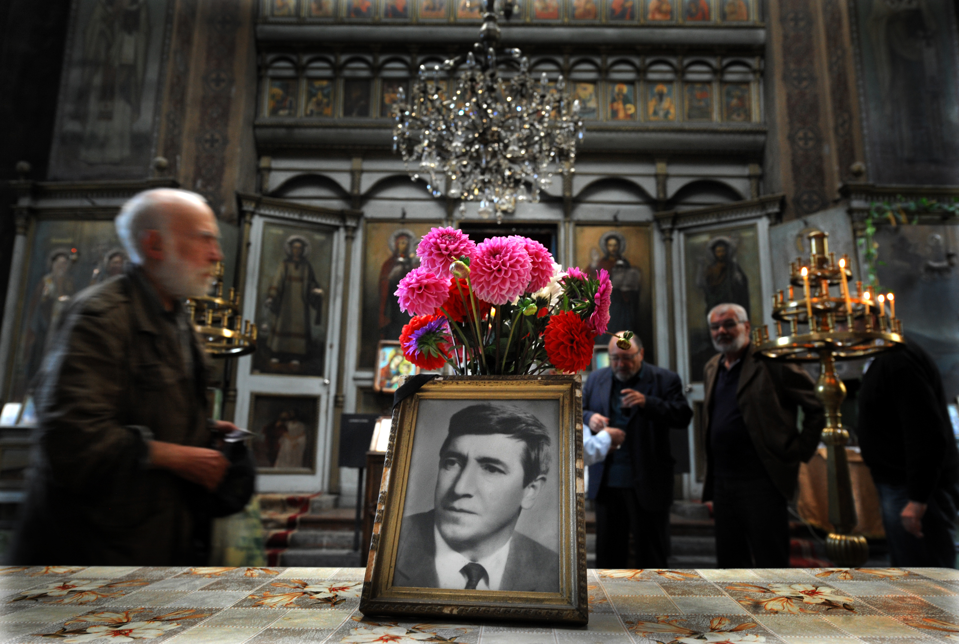People attend a commemoration service marking 35 years of the dead of Georgi Markov, a bulgarian disident killed in London in 1978, in a church in Sofia on September 11, 2013. Bulgaria is set to close a 35-year probe into the spectacular "umbrella killing" of dissident Georgy Markov in London in 1978, the prosecution in Sofia said Monday. Markov's murder has gone down as one of the most daring and extraordinary crimes of the Cold War. The prominent journalist and playwright fled communist Bulgaria in 1969 for Britain but continued to lambast the regime in reports for the BBC and Radio Free Europe. (AFP—AFP/Nikolay Doychinov/Getty Images)