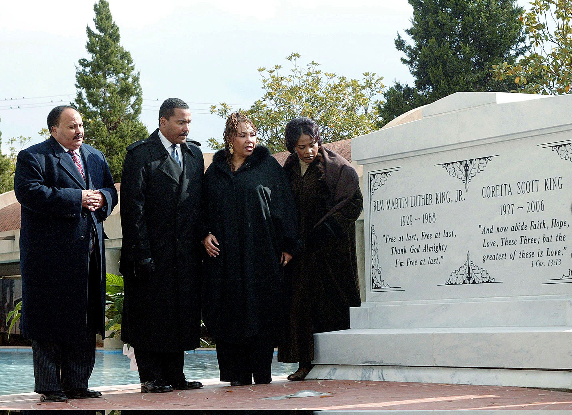 (From left) Martin Luther King III, Dexter King, Yolanda King and Bernice King stand next to a crypt dedicated to their parents in Atlanta on Nov. 20, 2006. (Wilfred Harewood—AP)