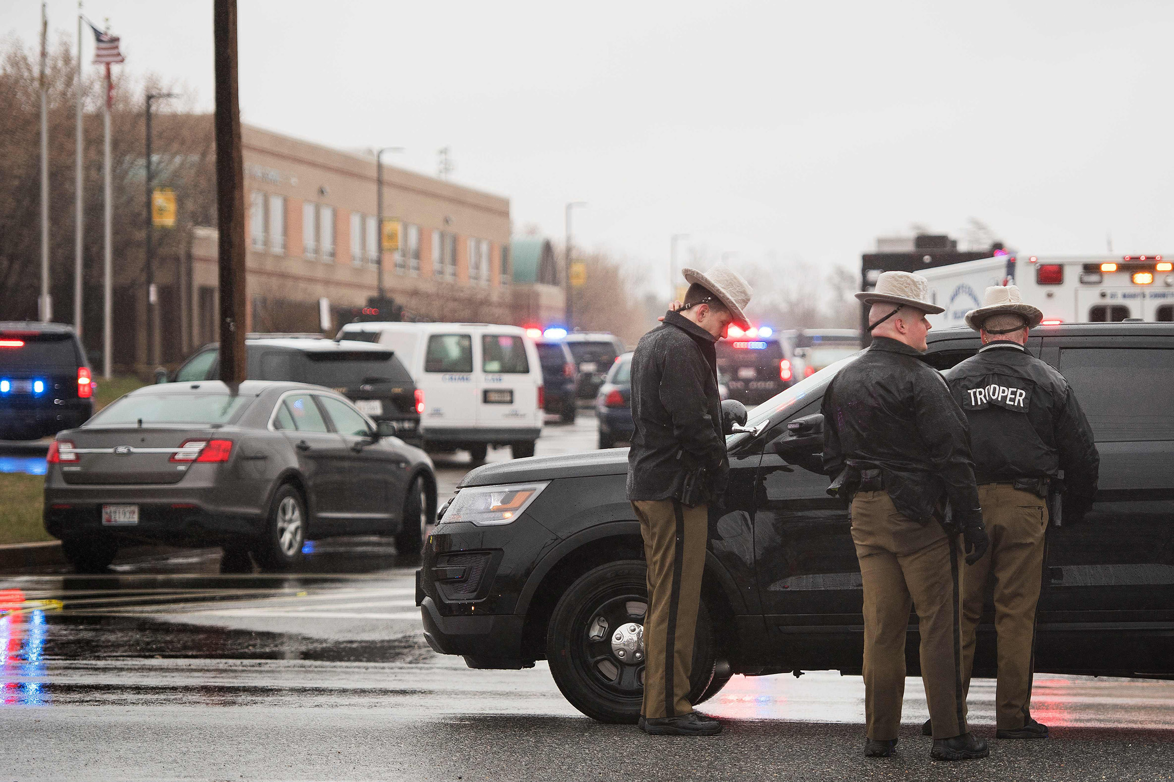 Maryland State Troopers gather on March 20, 2018 at Great Mills High School in Great Mills, Maryland after a shooting at the school. (Jim Watson—AFP/Getty Images)
