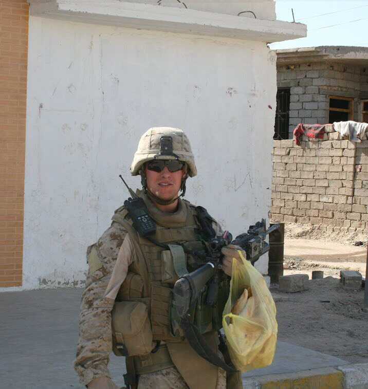 The author, carrying a bag of samoon — a type of bread — while on patrol in Fallujah, Iraq, in late 2007. (Courtesy of Matt Young)