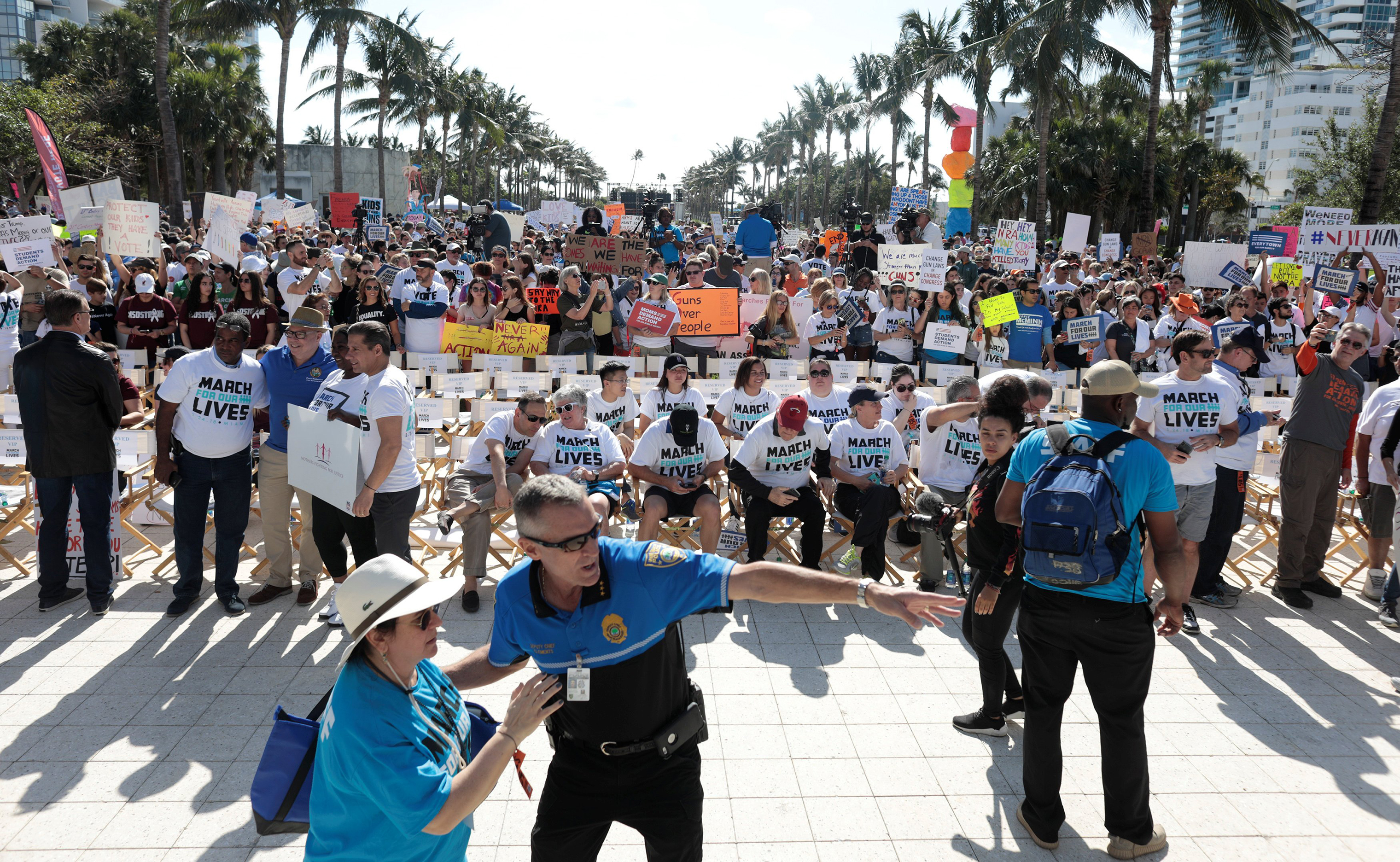 People stand while rallying in the street during the March For Our Lives demonstration, demanding stricter gun control laws, at the Miami Beach Senior High School. (Javier Galeano—Reuters)
