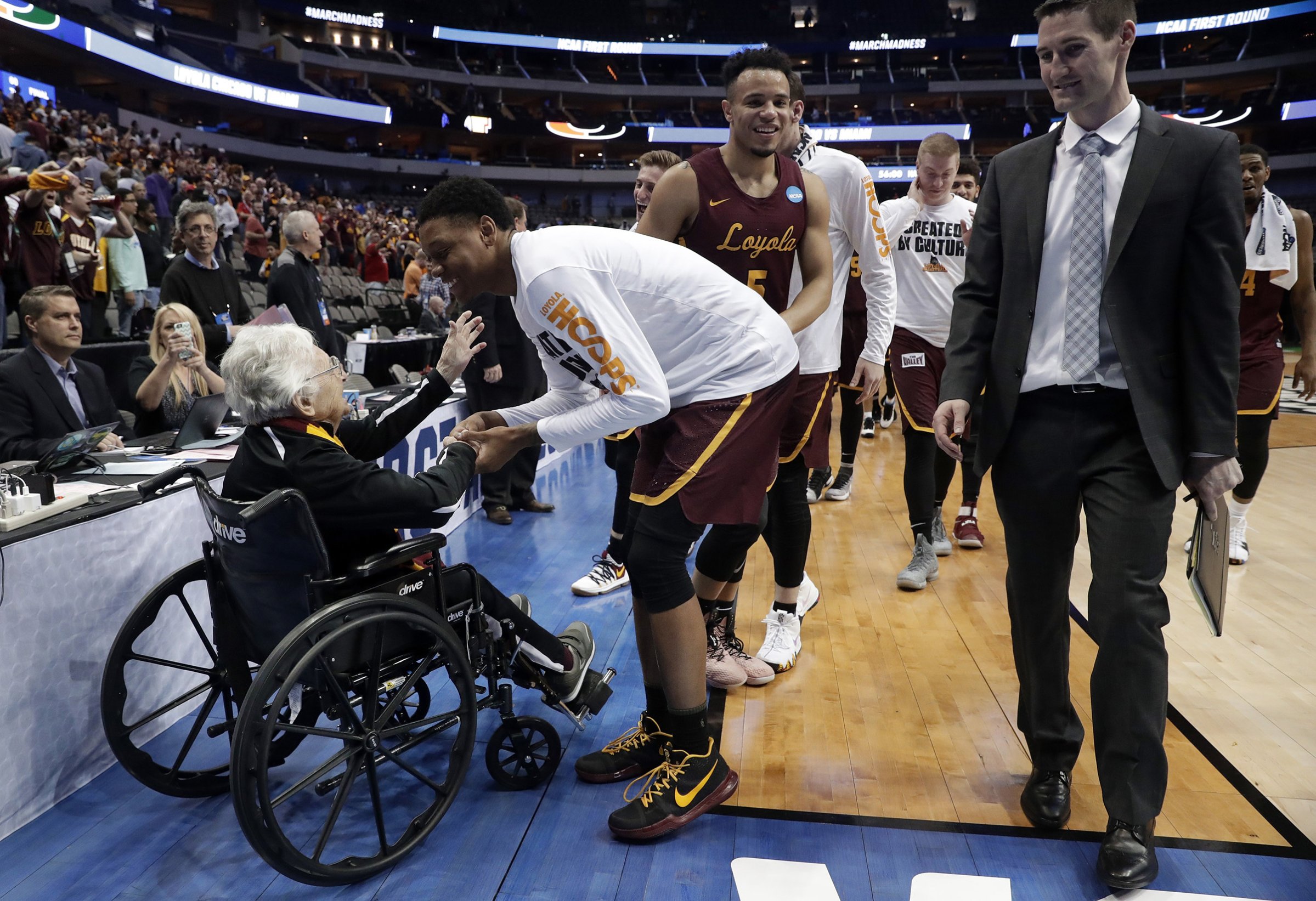 Sister Jean, the 98-year-old team chaplain for Loyola-Chicago, greets players after a win