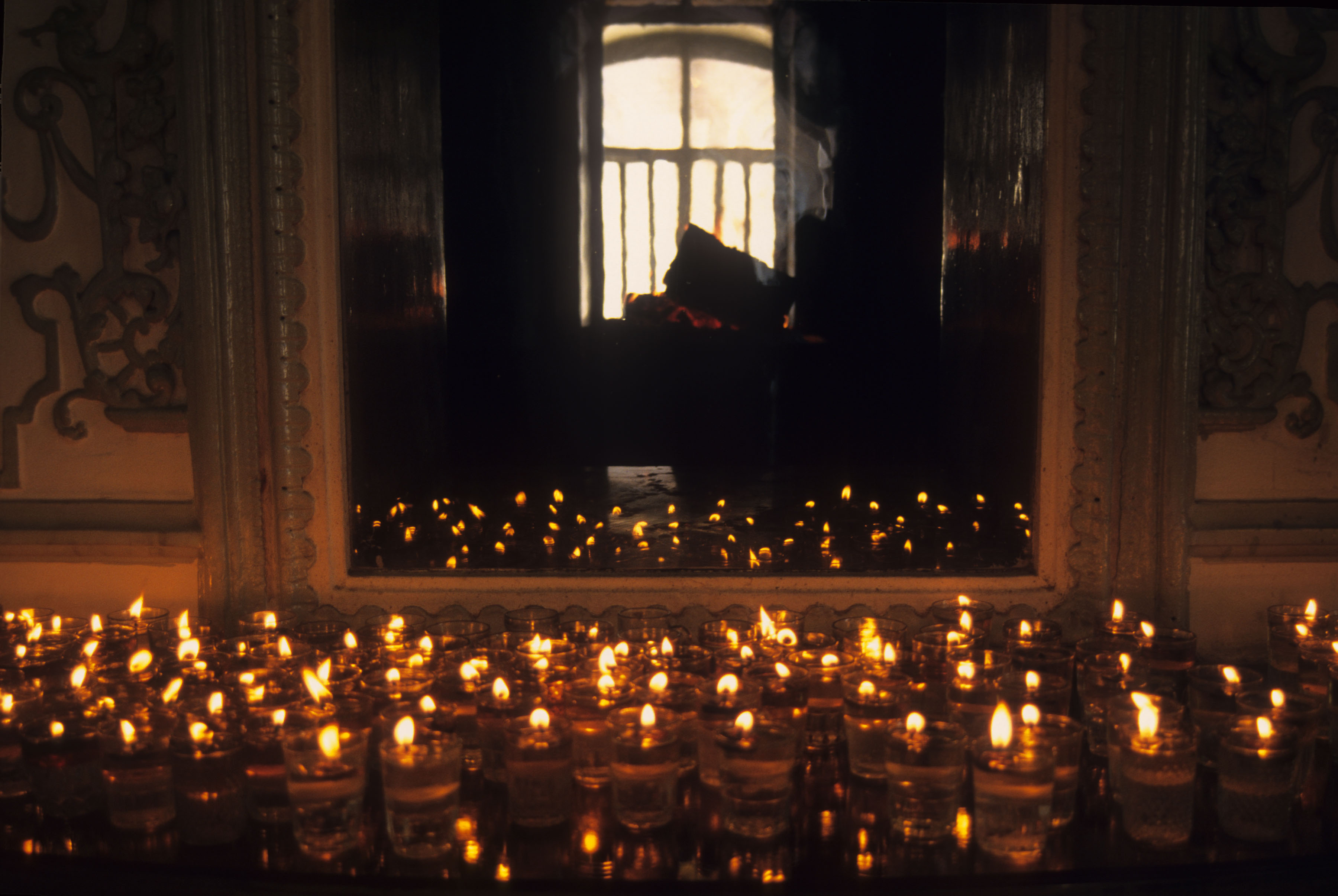 Candles in front of a mirror during a Nowruz (Iranian new year) ceremony at the Rostam Bagh Zoroastrian fire temple in Tehran, Iran, circa 1995. (Photo by Kaveh Kazemi/Getty Images) (Kaveh Kazemi&mdash;Getty Images)