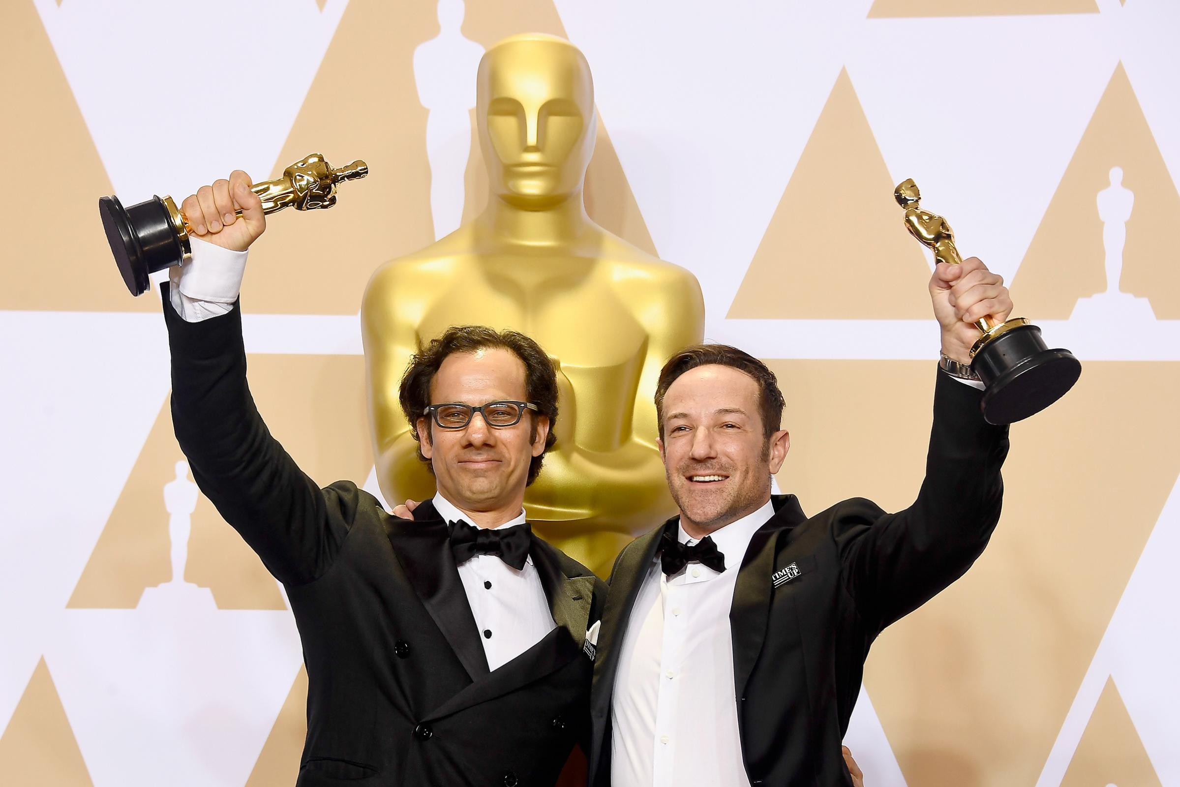 Producer Dan Cogan and director Bryan Fogel, winners of the Best Documentary Feature award for 'Icarus,' pose in the press room during the 90th Annual Academy Awards at Hollywood &amp; Highland Center on March 4, 2018 in Hollywood.