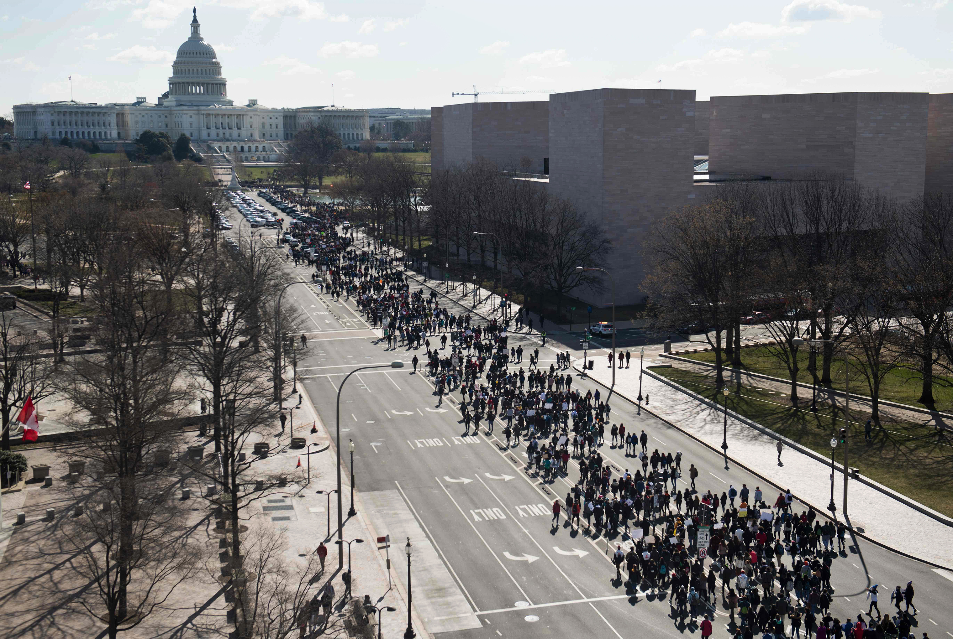 Thousands of local students march down Pennsylvania Avenue to the US Capitol during a nationwide student walkout for gun control in Washington, DC, March 14, 2018. (Saul Loeb—AFP/Getty Images)