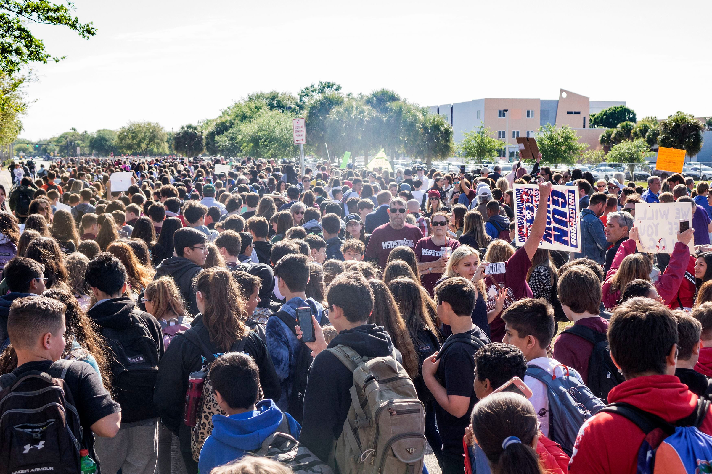 Community members and students participate in the national school walkout outside the Marjory Stoneman Douglas High School in Parkland, Fla., on March 14, 2018. (Cristobal Herrera—EPA-EFE/Shutterstock)