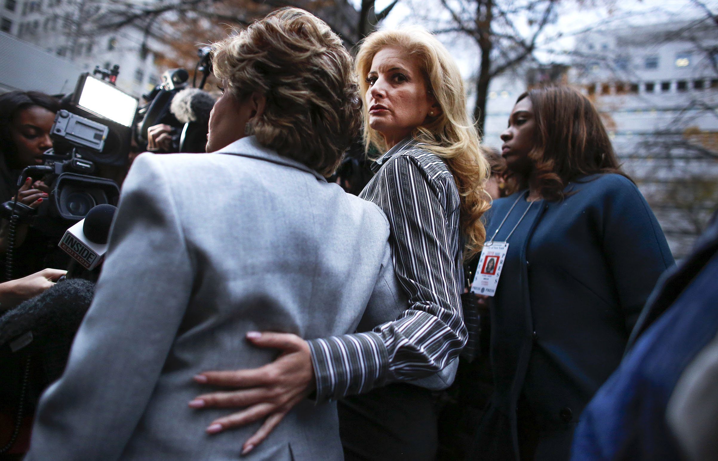 Summer Zervos a former contestant on "The Apprentice" looks at the camera as she embraces lawyer Gloria Allred after they leave the New York County Criminal Court on Dec. 5, 2017. (Kena Betancur—AFP/Getty Images)