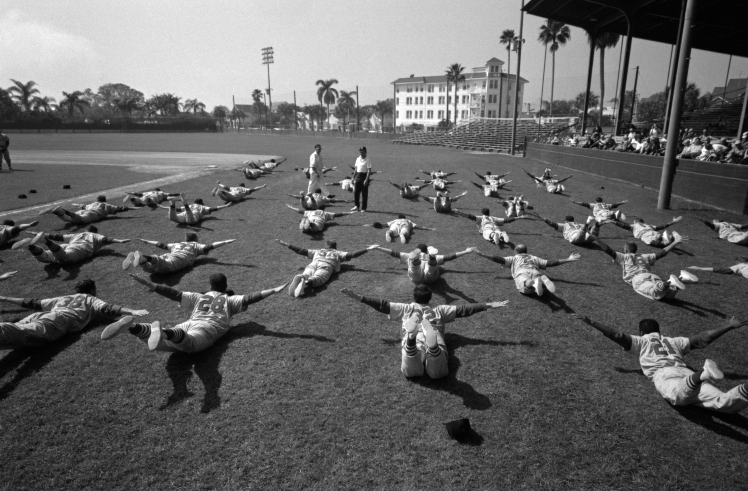 Members of the St. Louis Cardinals stretch during Spring Training in March, 1960 at Al Lang Field in St. Petersburg, Fla. (Diamond Images/Getty Images)