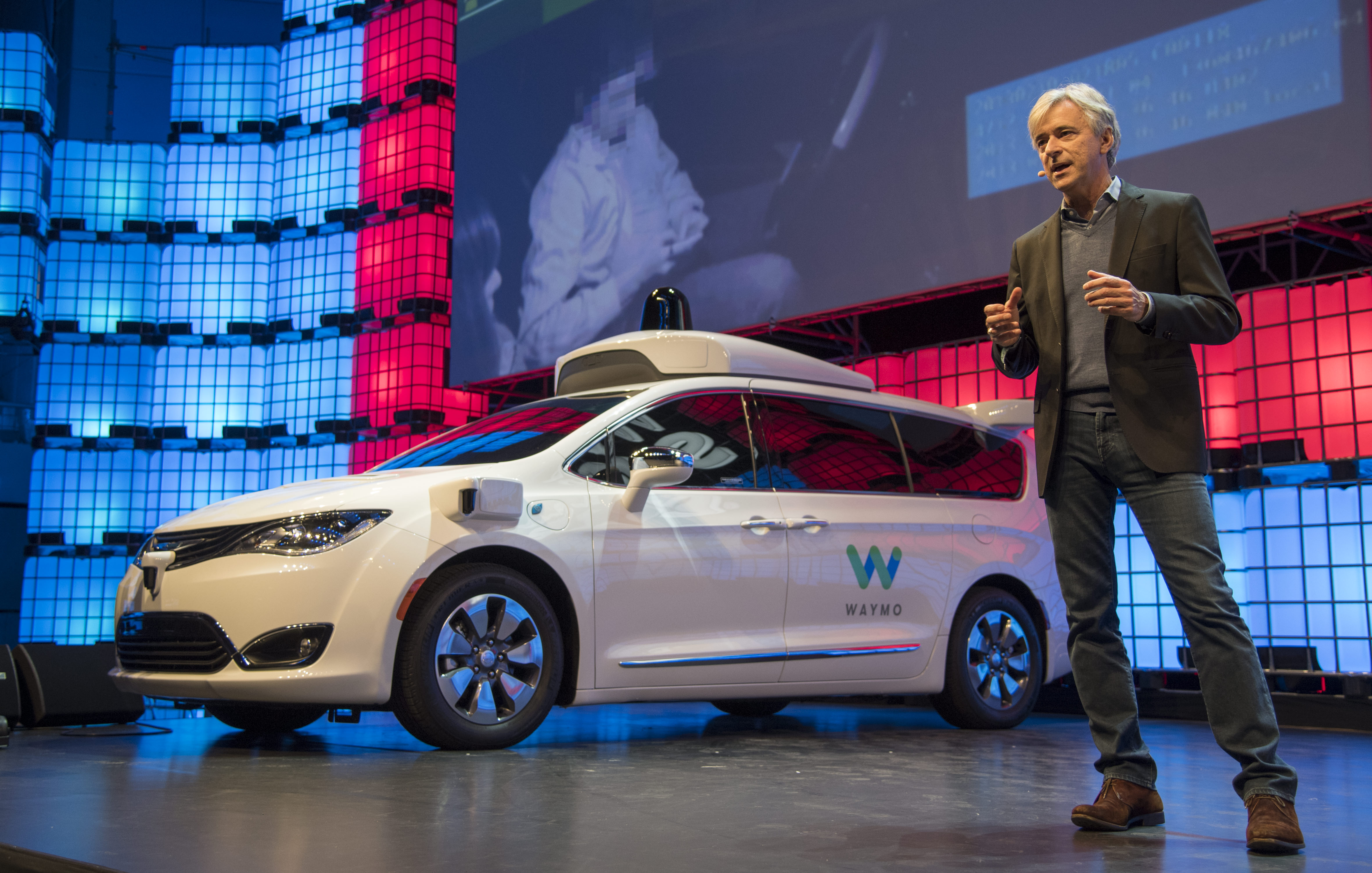 Waymo CEO John Krafcik presents the company's plans for self-driving cars at Web Summit on Nov. 07, 2017 in Lisbon (Horacio Villalobos - Corbis—Getty Images)