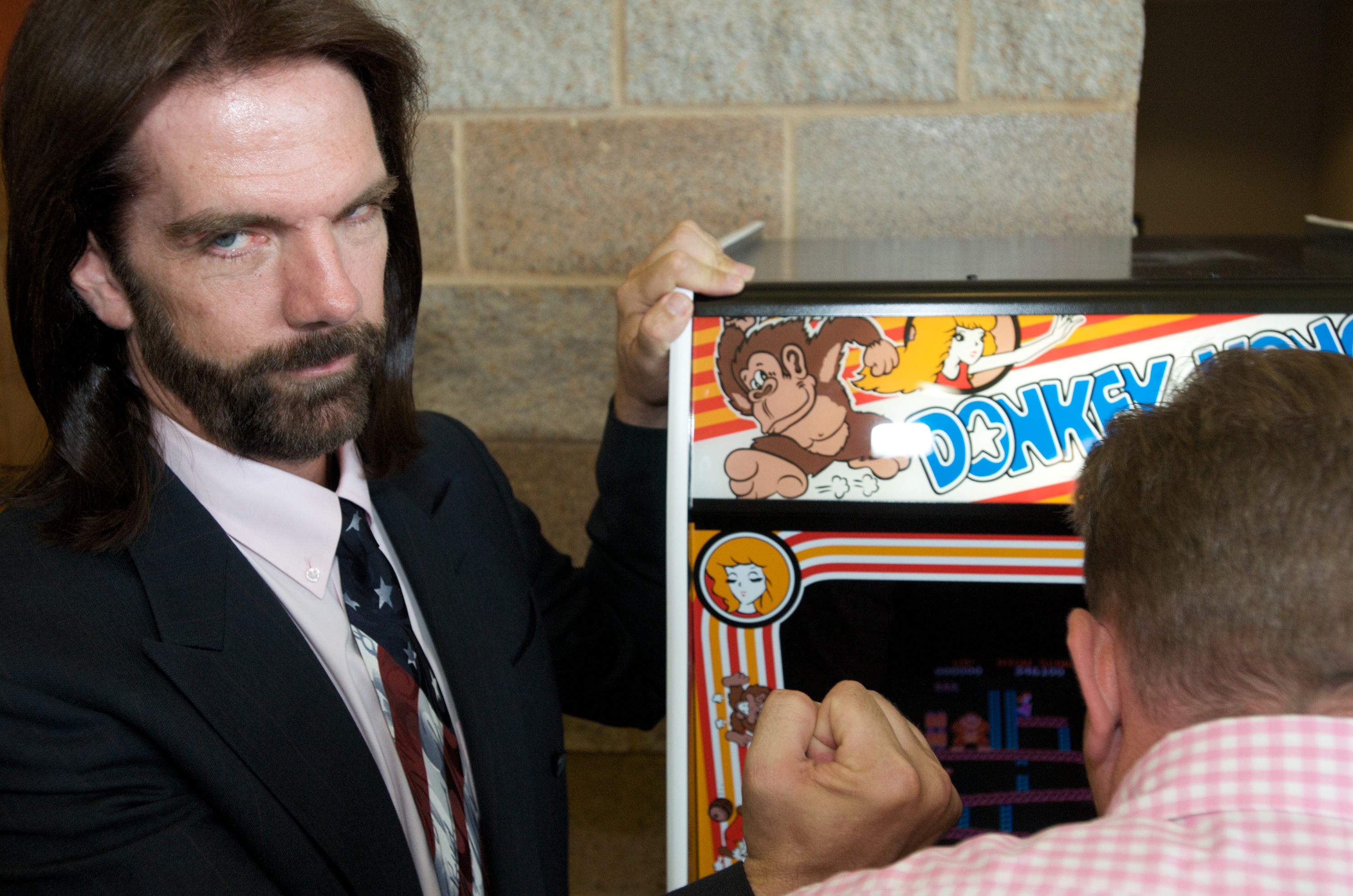Billy Mitchell, the Video Game Player of the Century, poses while Steve Sanders, 'The Orignal King of Kong,' plays Donkey Kong at the launch party for the International Video Game Hall of Fame and Museum on August 13, 2009 in Ottumwa, Iowa. (David Greedy&mdash;Getty Images)