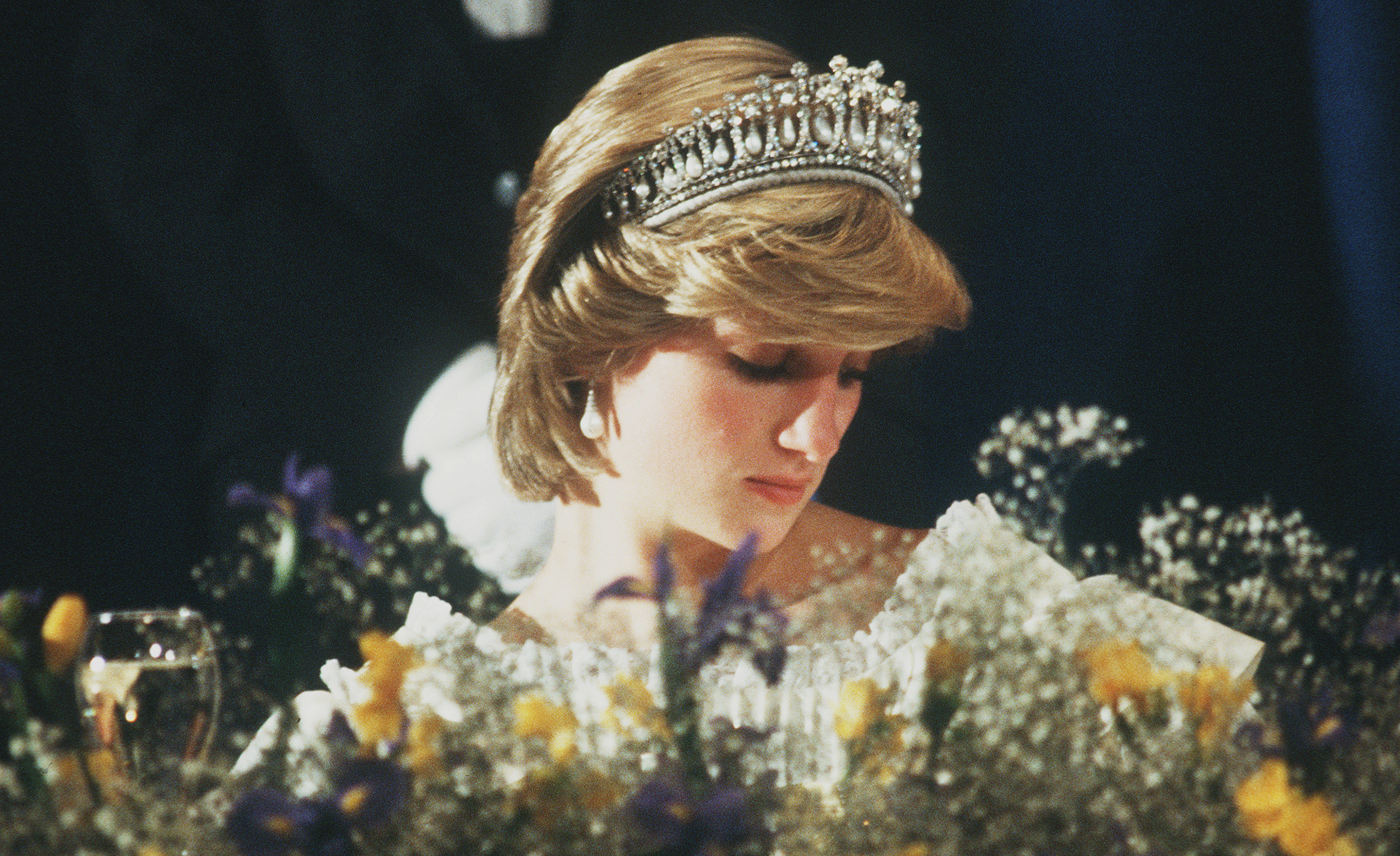 Diana, Princess of Wales wears the Cambridge Lover's Knot tiara (Queen Mary's Tiara) and diamond earrings during a banquet on April 29, 1983 in Aukland, New Zealand. (Anwar Hussein—Getty Images)