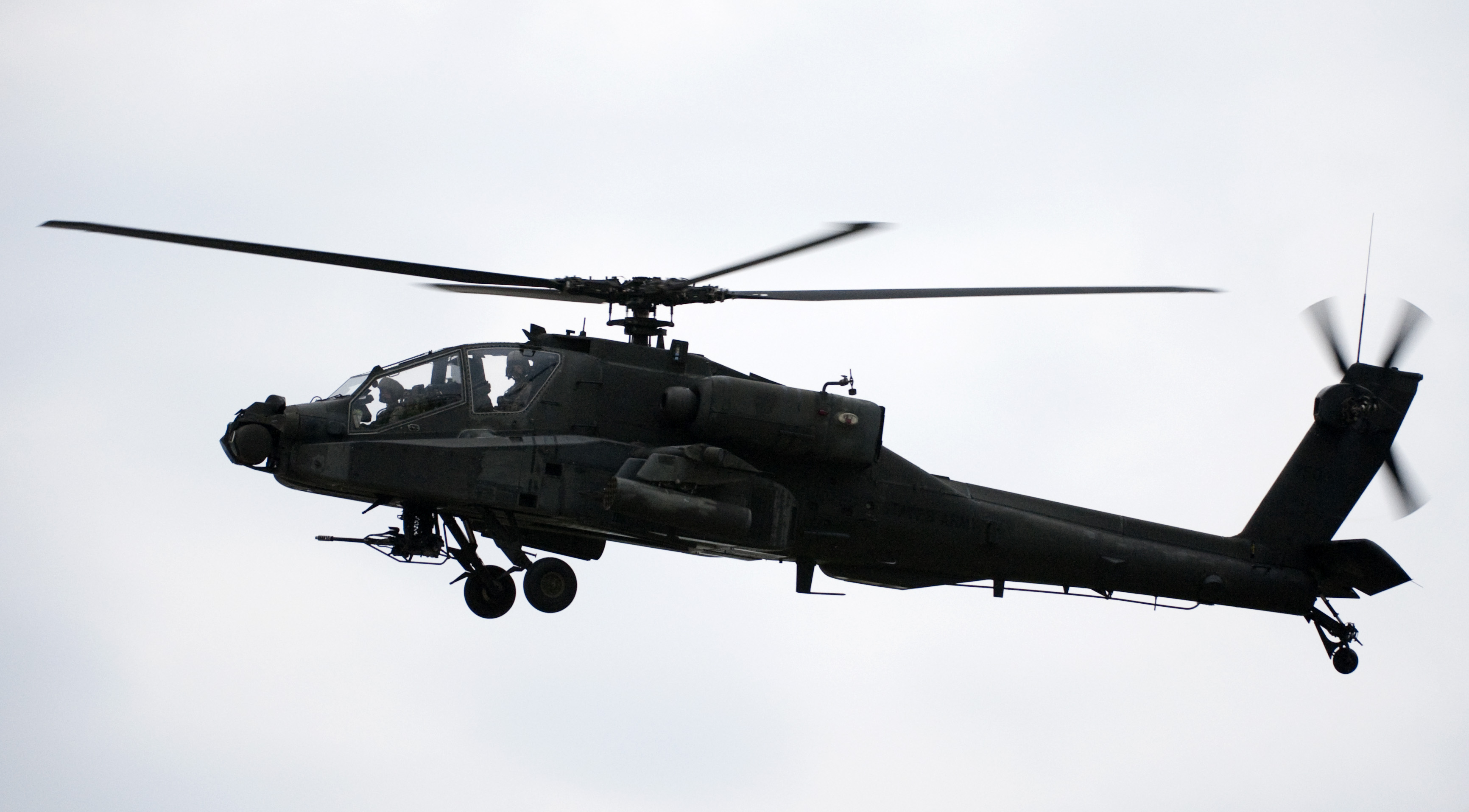 An Apache helicopter hovers over the race track during pre race ceremony before the start of the IRL IndyCar Series Meijer Indy 300 on August 1, 2009 at the Kentucky Speedway in Sparta, Kentucky. (Photo by Robert Laberge—Getty Images)