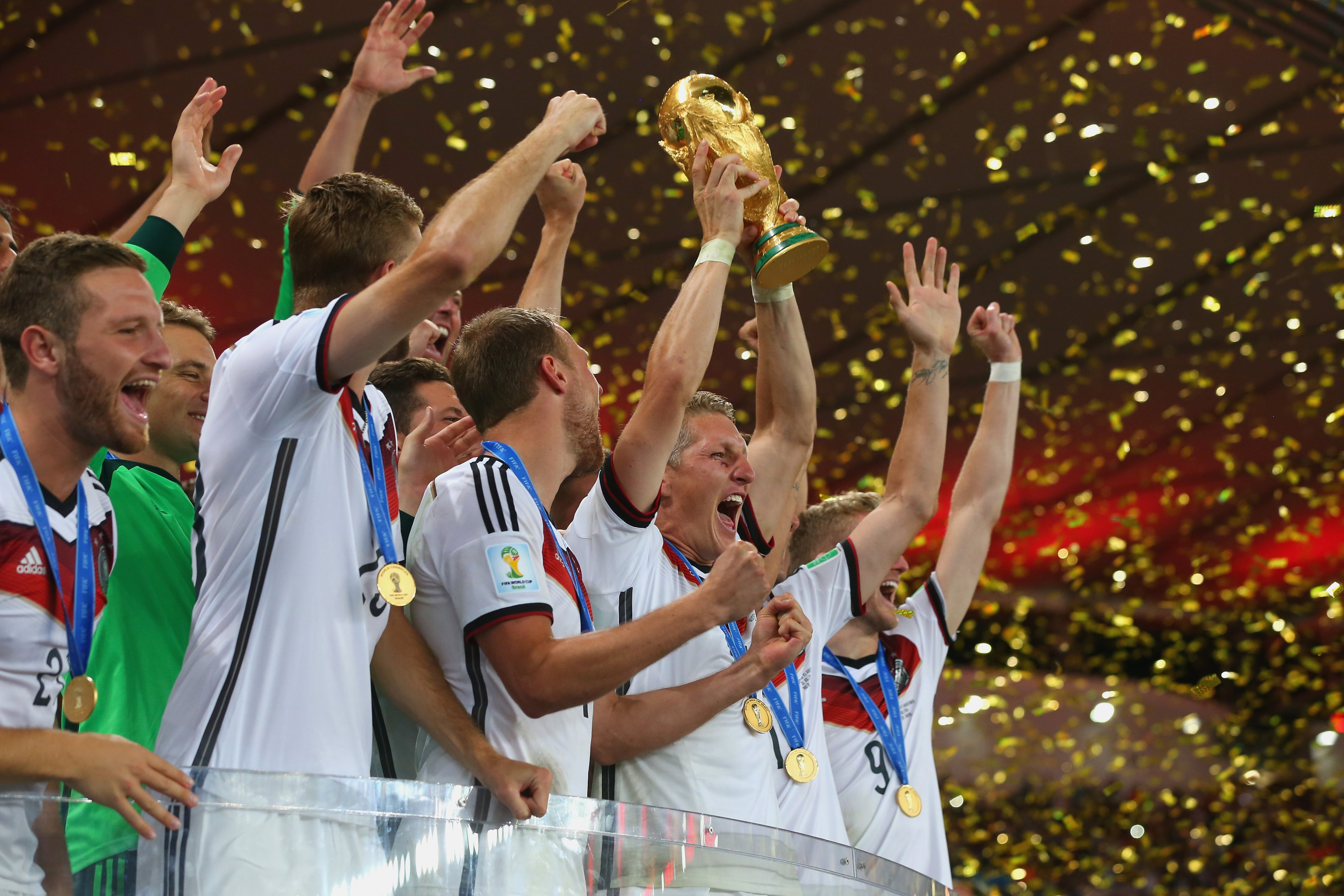Germany's Bastian Schweinsteiger and teammates lift the World Cup trophy to celebrate the country's 2014 FIFA World Cup win in Rio de Janeiro, Brazil. Alexander Hassenstein - FIFA/FIFA via Getty Images (Alexander Hassenstein - FIFA&mdash;FIFA via Getty Images)