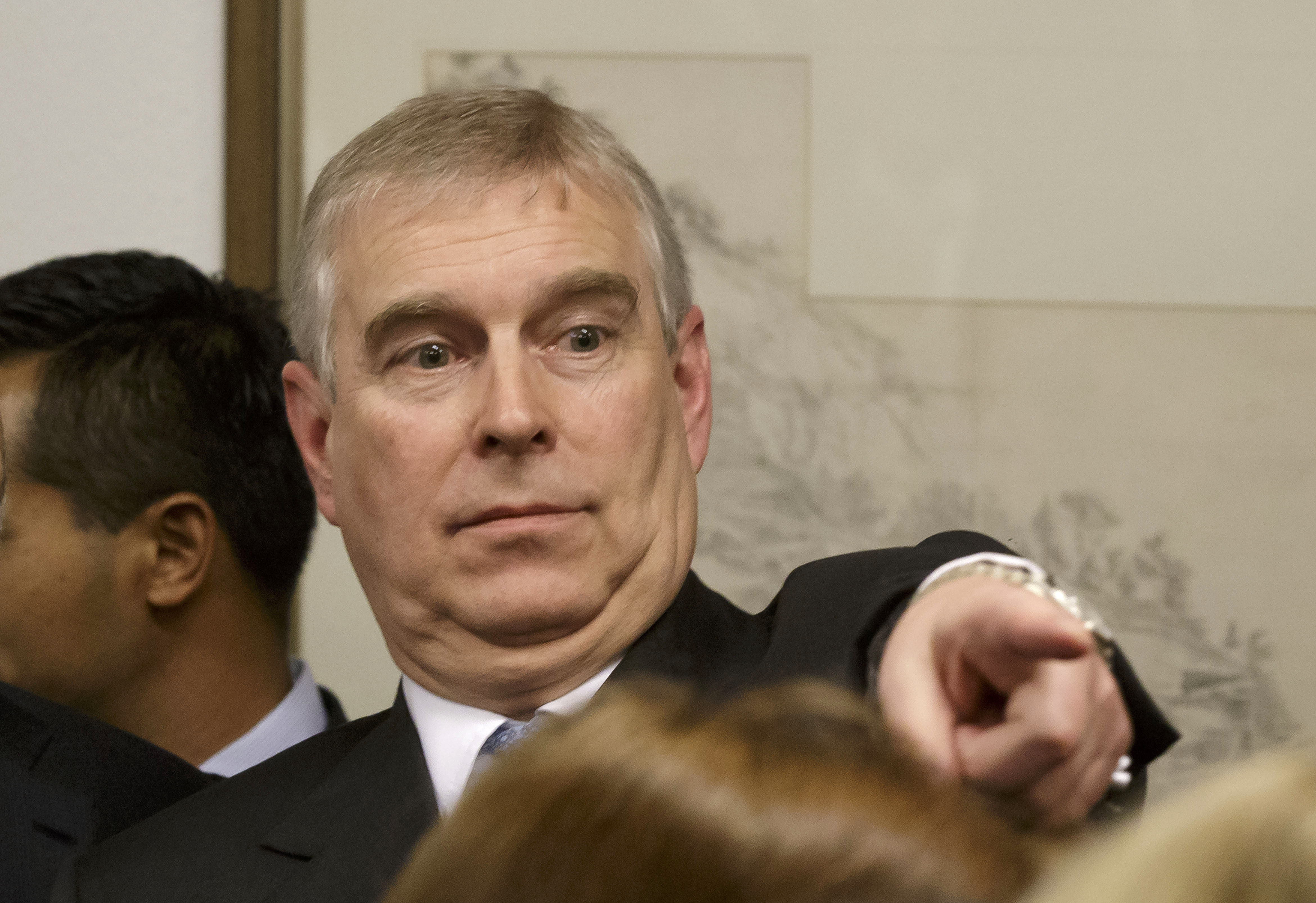 Prince Andrew, Duke of York points his finger as he speaks to business leaders during a reception at the sideline of the World Economic Forum on January 22, 2015 in Davos Switzerland. (Michel Euler/WPA Pool—Getty Images)