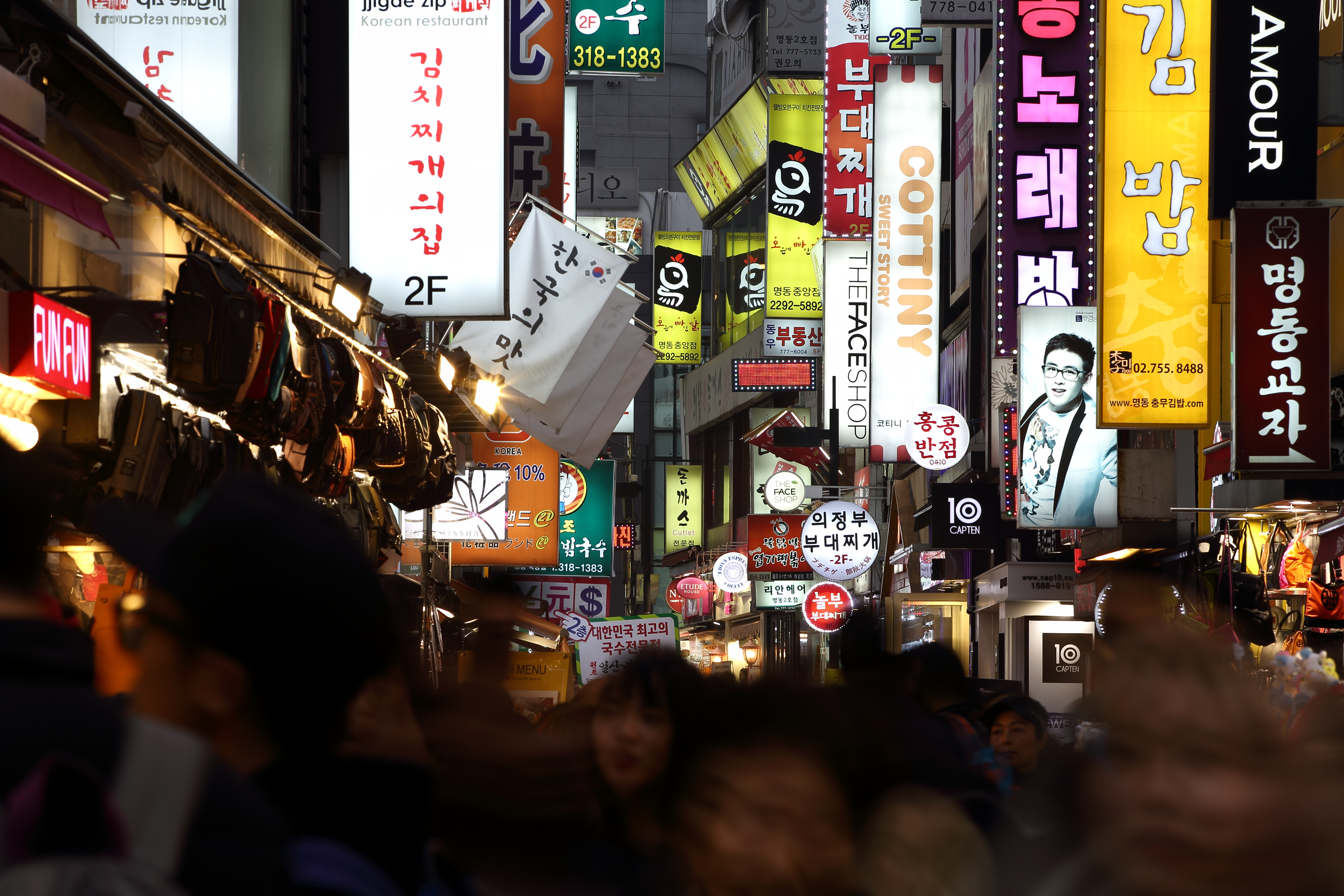 Illuminated signboards light up a street in the evening in the Myeongdong district of Seoul, South Korea, on Feb. 27, 2014. (SeongJoon Cho—Bloomberg/Getty Images)