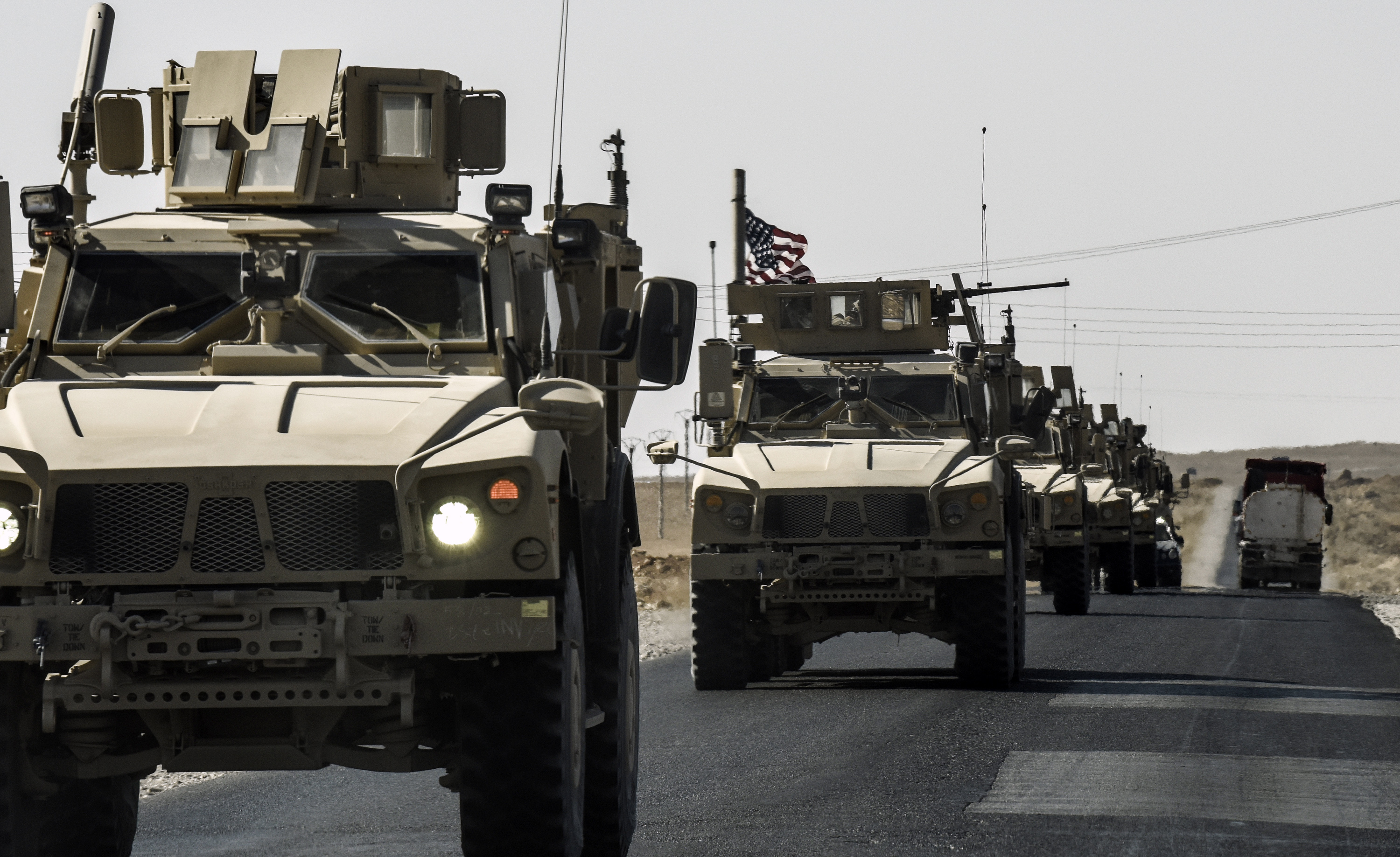 A U.S. military convoy drives on a highway from Kobane to Ain Issa on Sept. 29, 2017. (Bulent Kilic—AFP/Getty Images)
